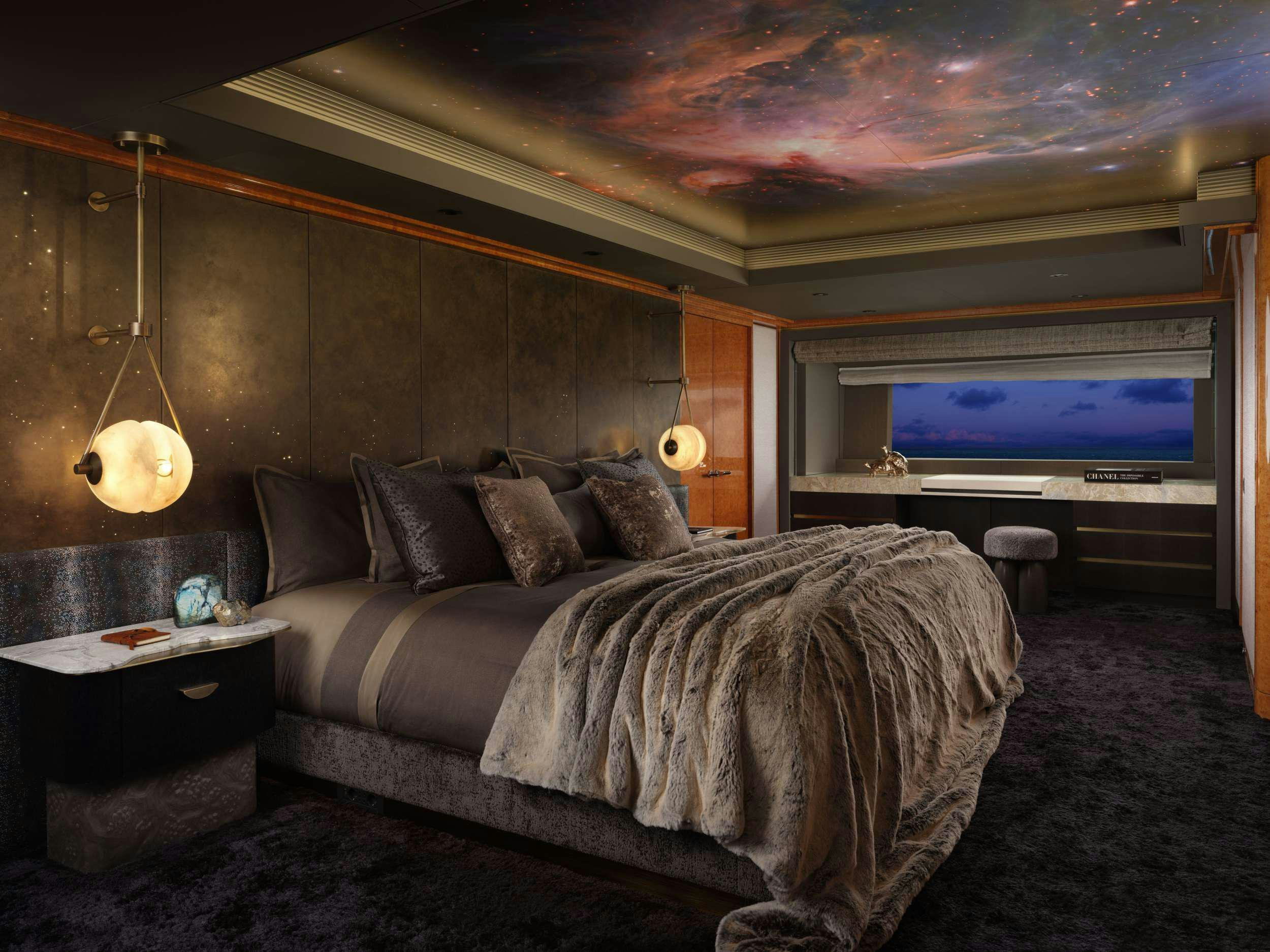 a living room with a large bed aboard GALAXY Yacht for Charter