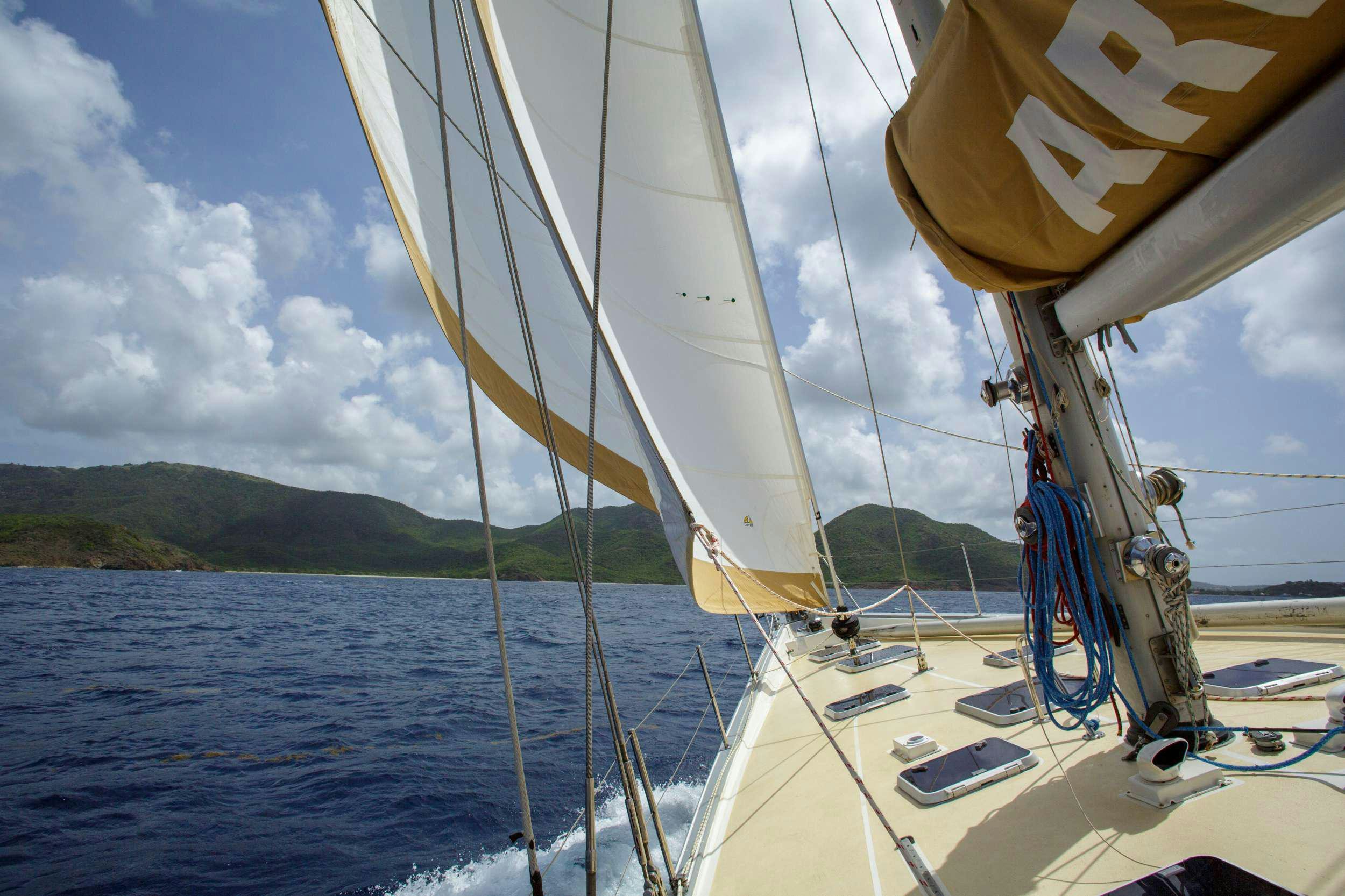 a sailboat on the water aboard ARROW OF AYR Yacht for Charter