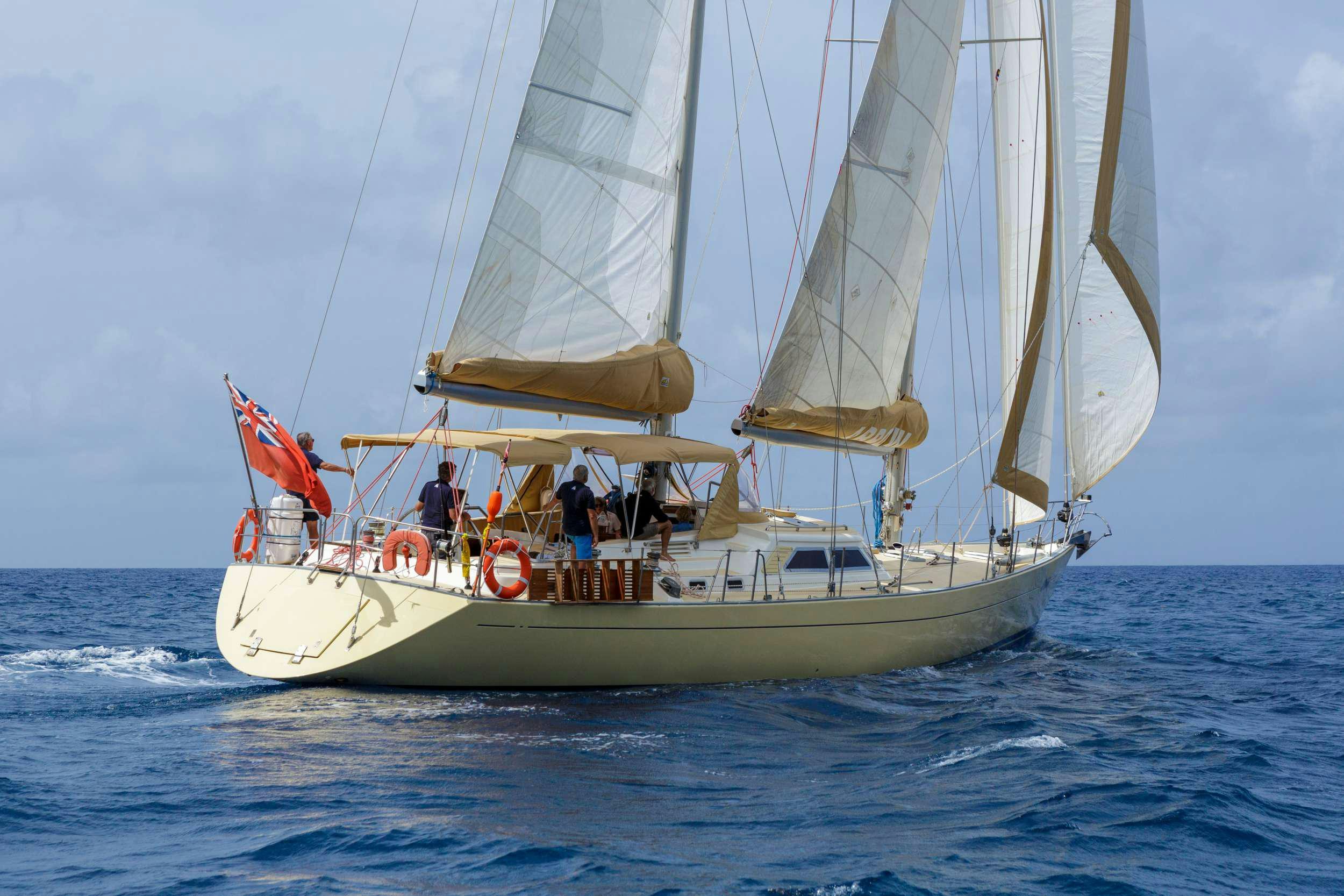 a sailboat with people on it aboard ARROW OF AYR Yacht for Charter