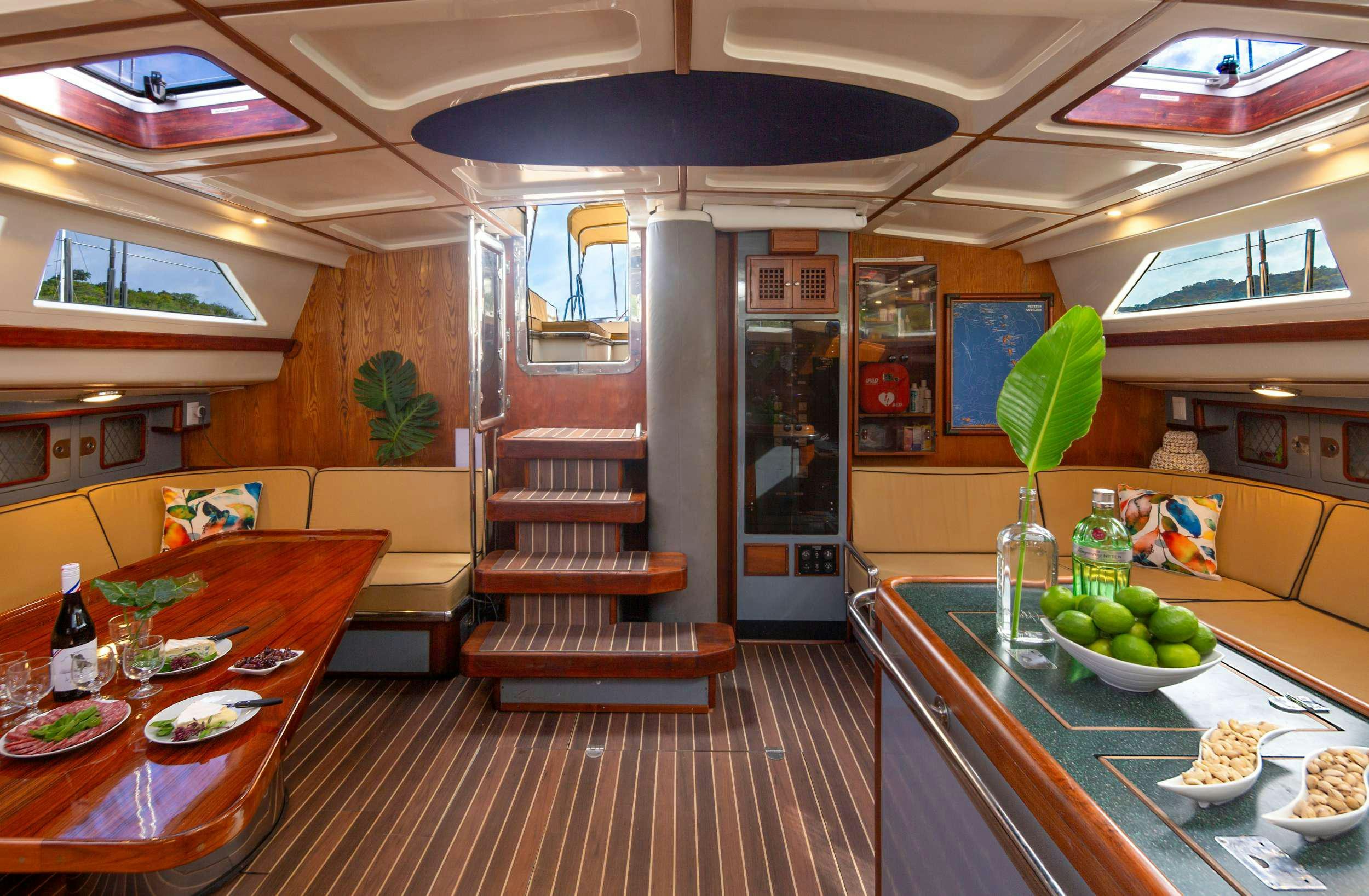 a kitchen with a table and chairs aboard ARROW OF AYR Yacht for Charter