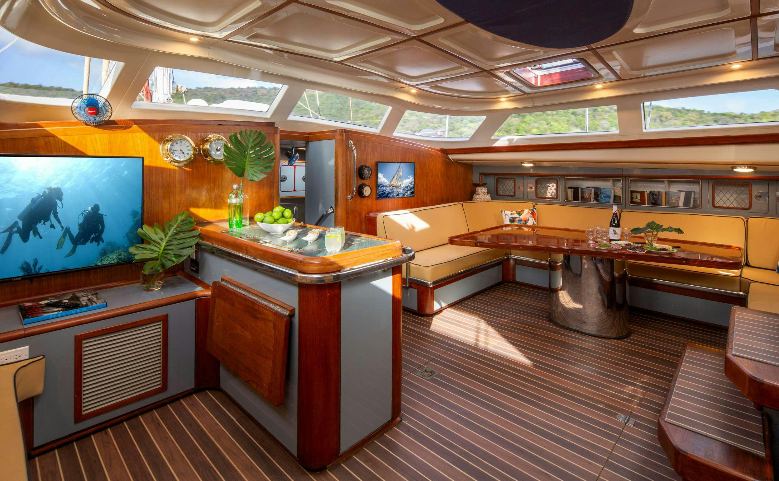 a room with a tv and a counter aboard ARROW OF AYR Yacht for Charter