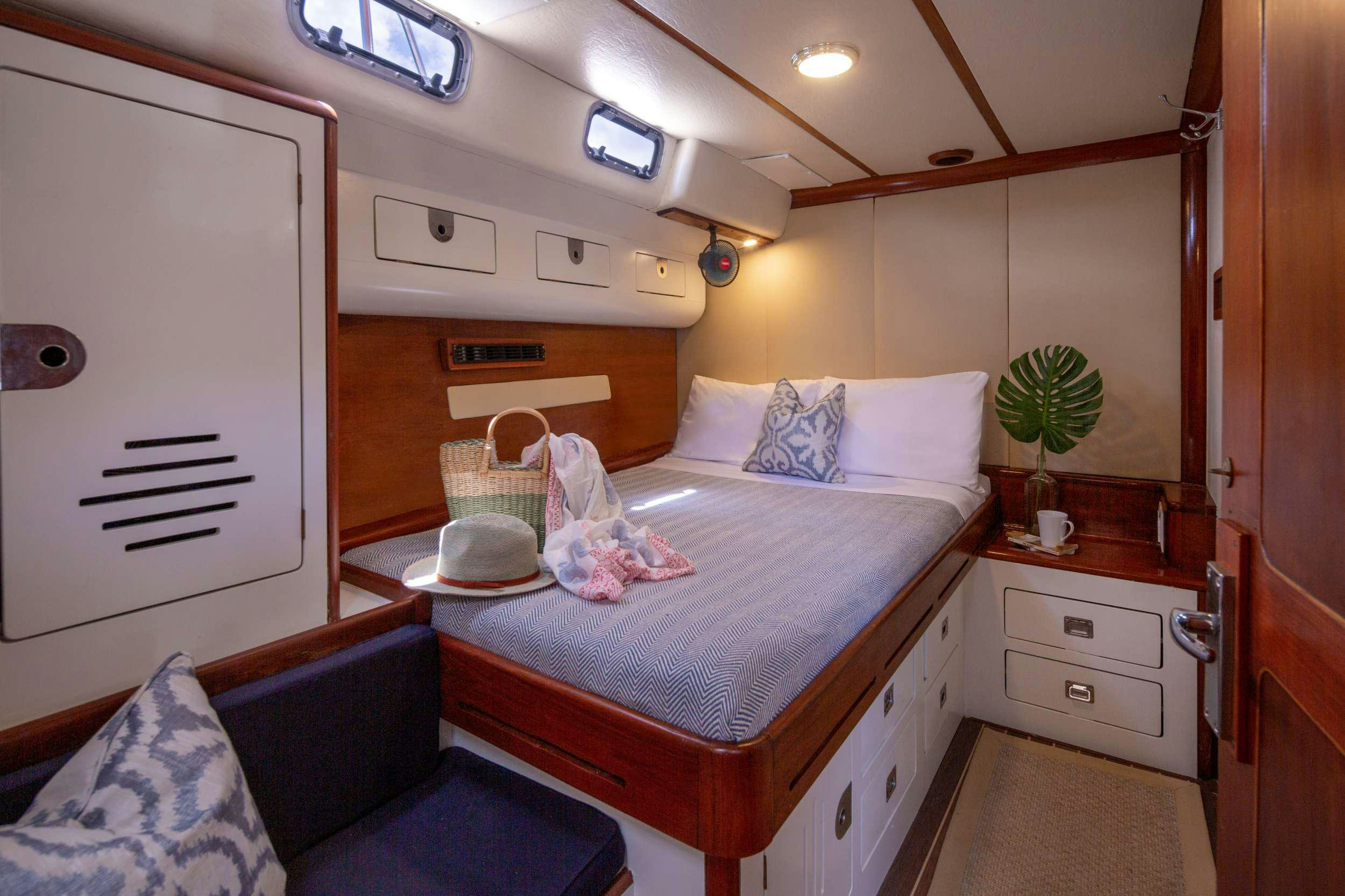 a bed in a room aboard ARROW OF AYR Yacht for Charter