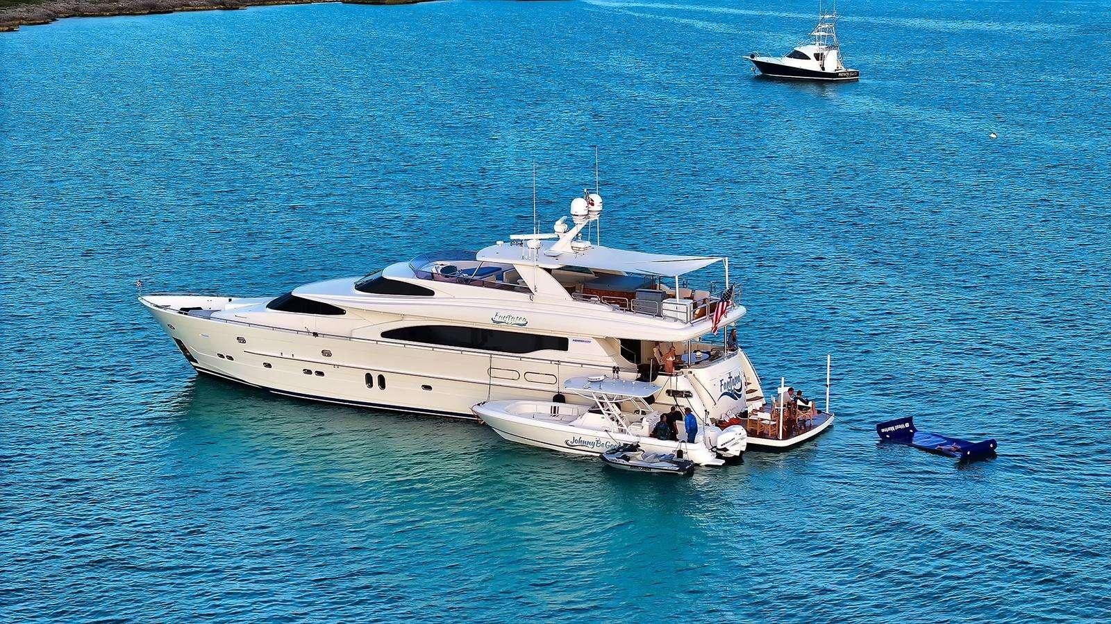 a large white yacht in the water aboard FANTASEA Yacht for Charter