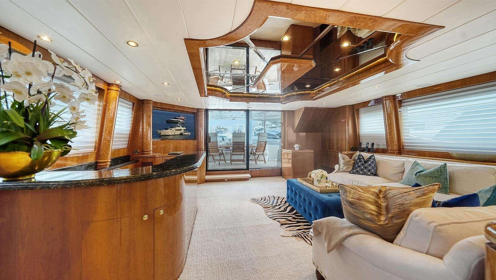 a room with a couch and a table aboard FANTASEA Yacht for Charter