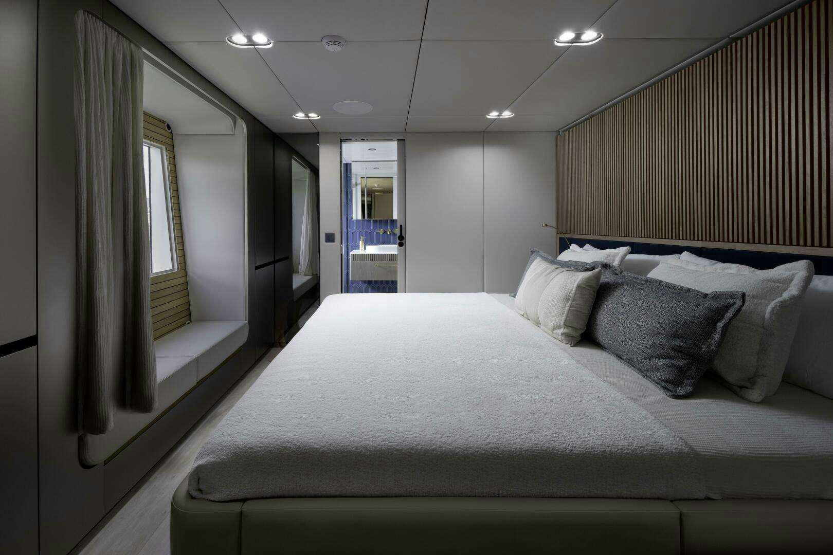 a bed in a room aboard NAUTI NICKEL Yacht for Charter