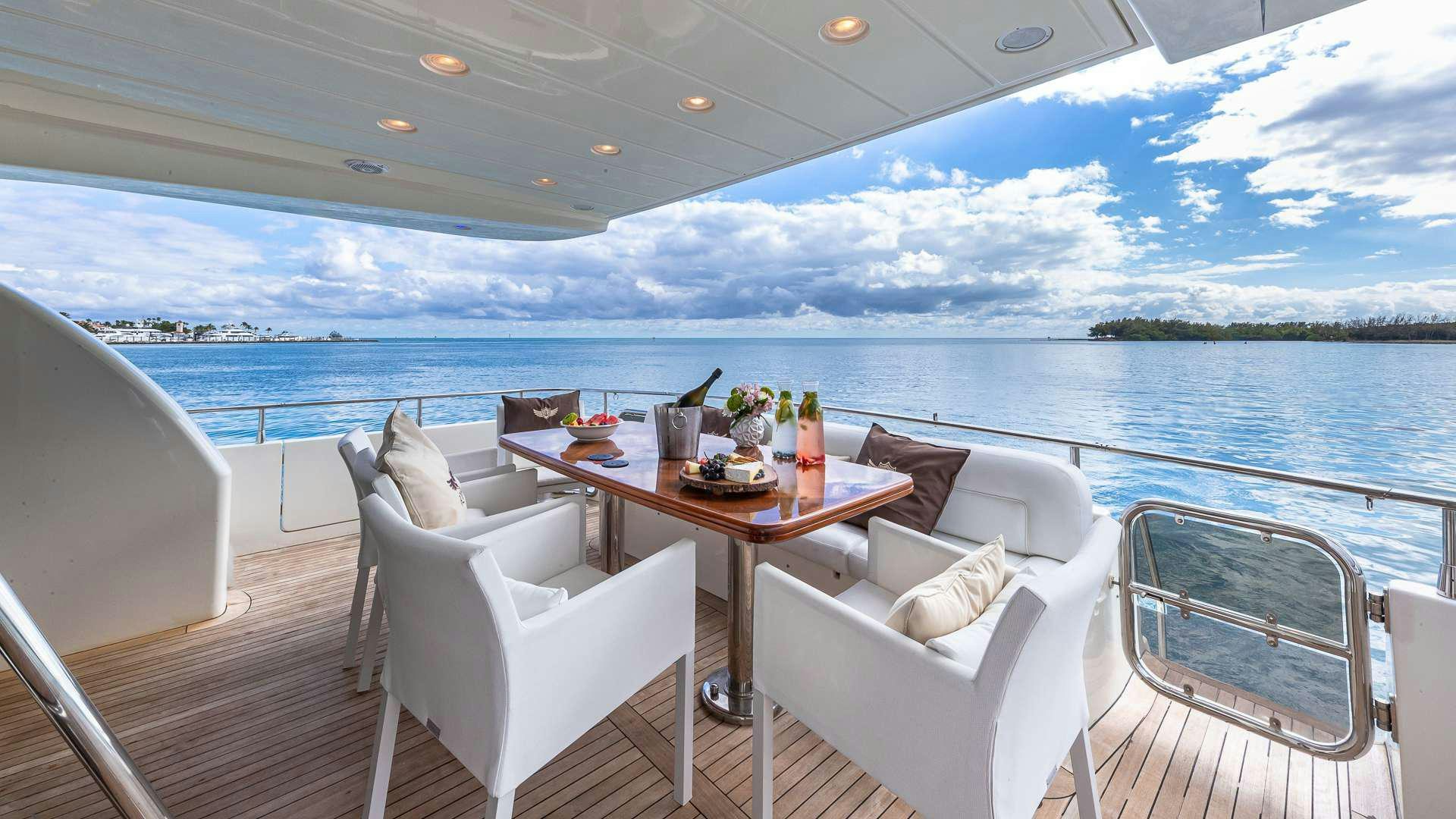 a table and chairs on a boat aboard SALT SHAKER Yacht for Charter