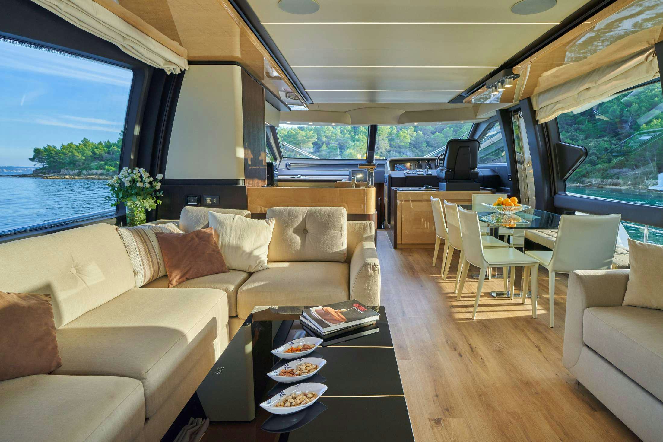 a living room with a couch and a table aboard AZIMUT 72 - RELAX OF Yacht for Charter