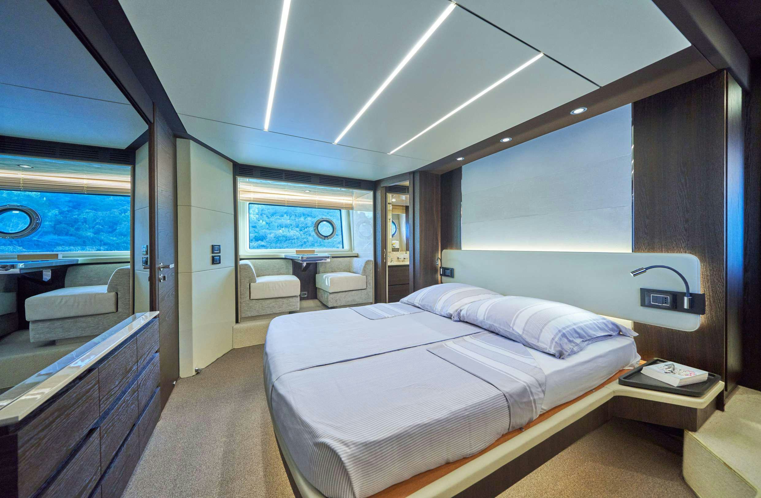 a room with a bed and a window aboard AZIMUT 72 - RELAX OF Yacht for Charter