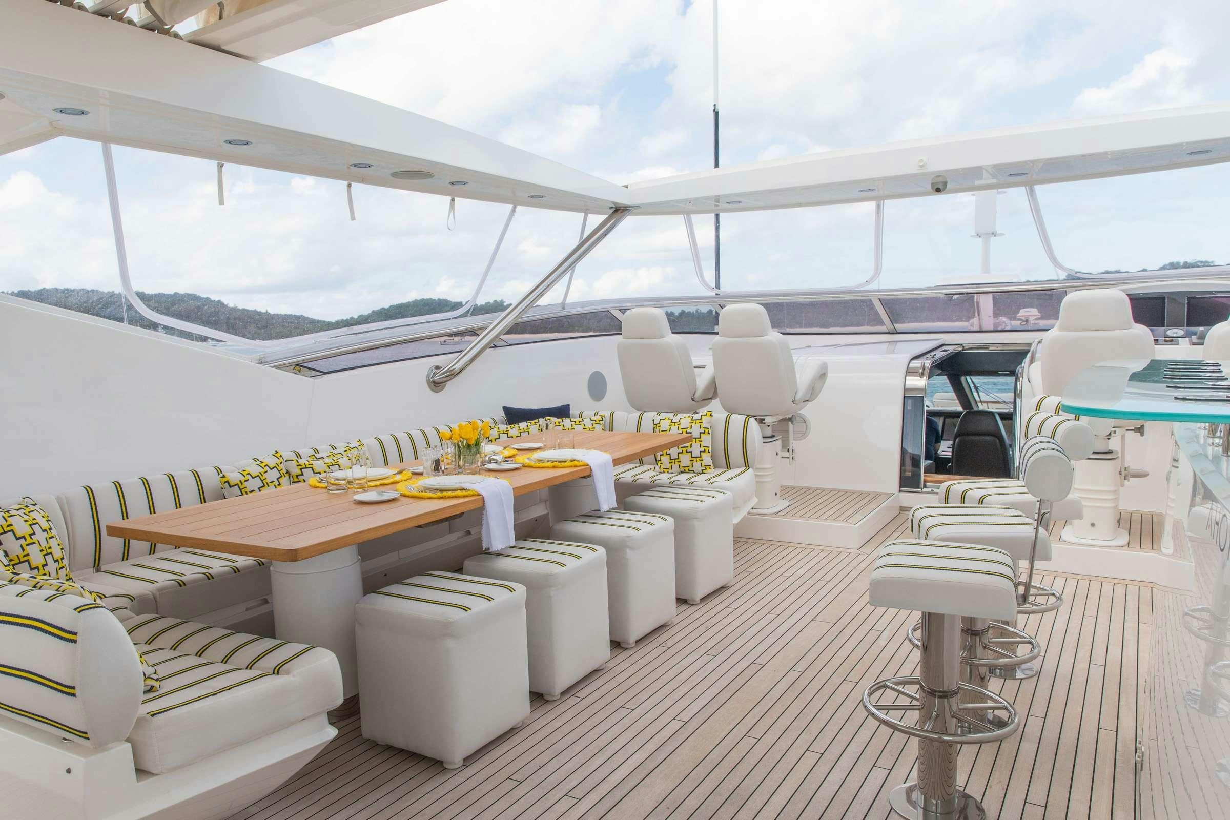 a room with a table and chairs aboard RASCAL Yacht for Charter
