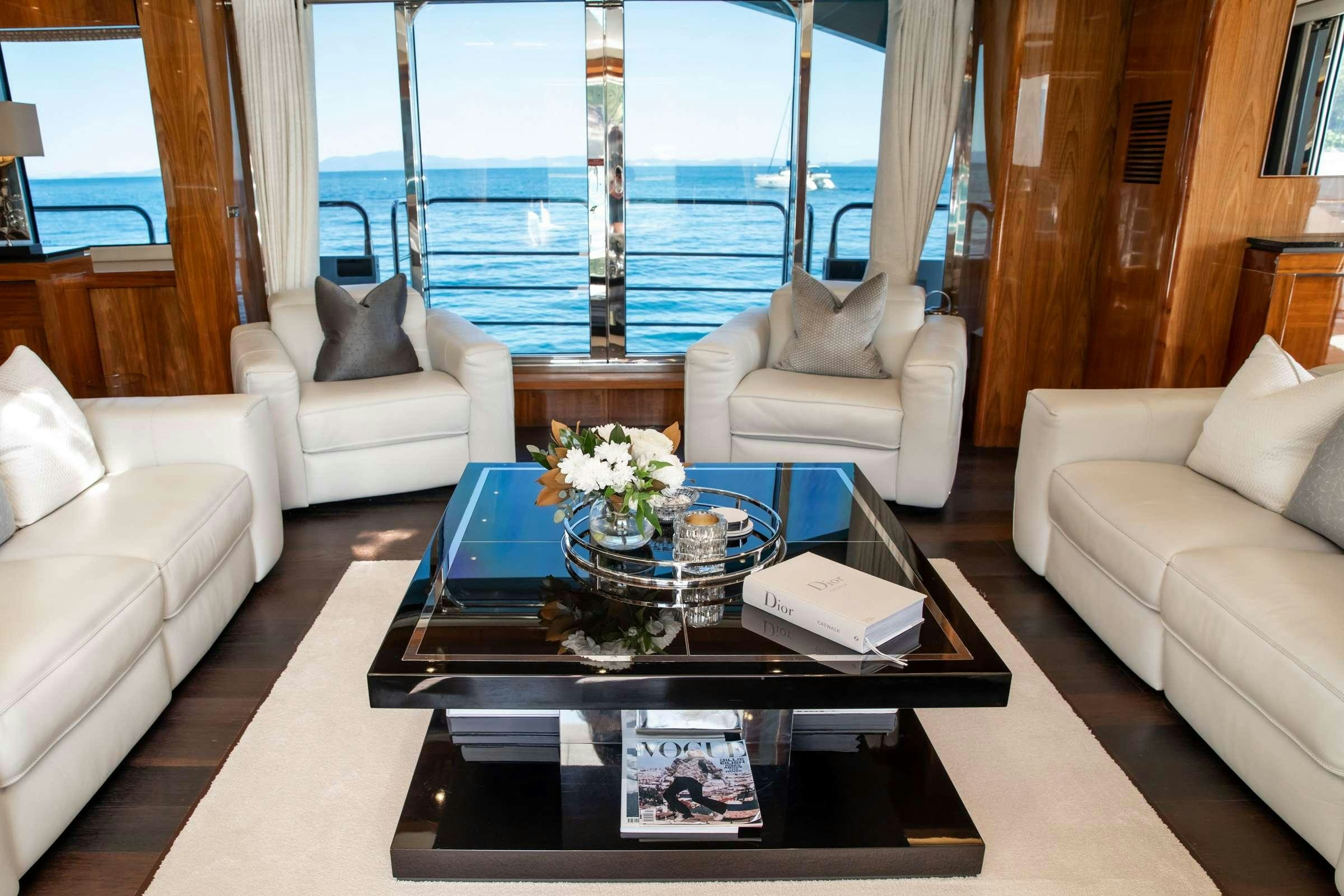 a living room with a large balcony aboard RASCAL Yacht for Charter