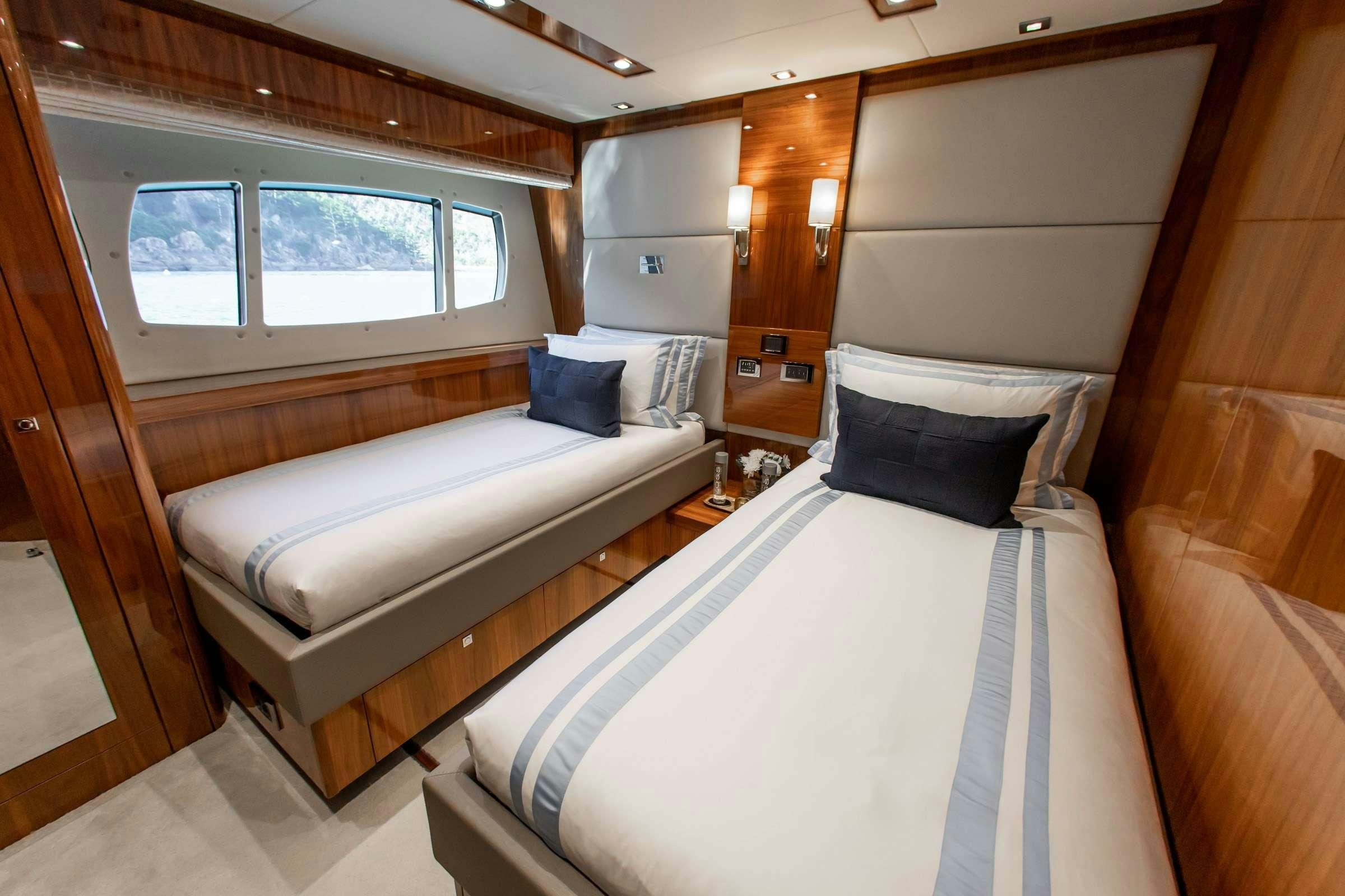 a room with two beds aboard RASCAL Yacht for Charter