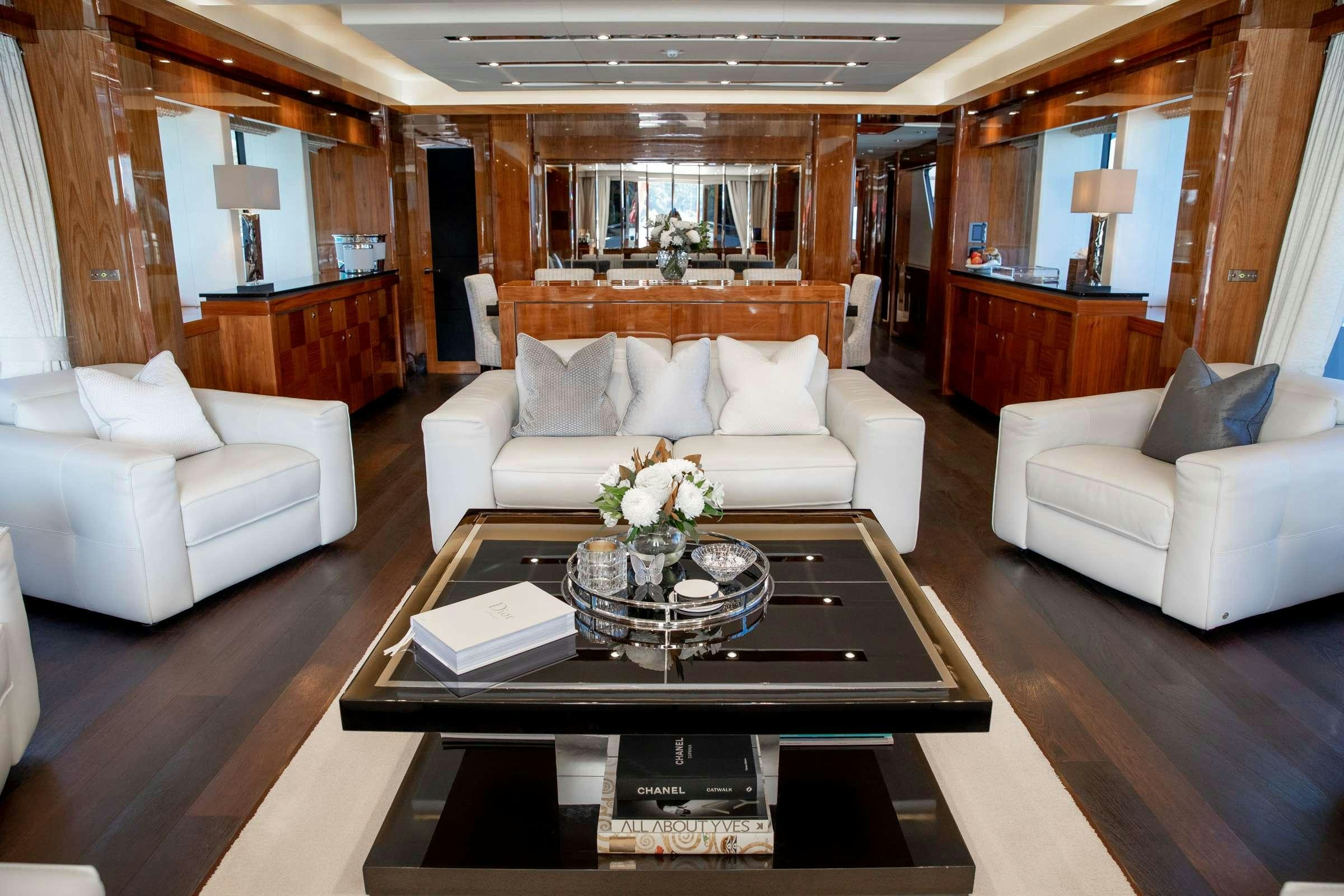 a living room with a coffee table aboard RASCAL Yacht for Charter
