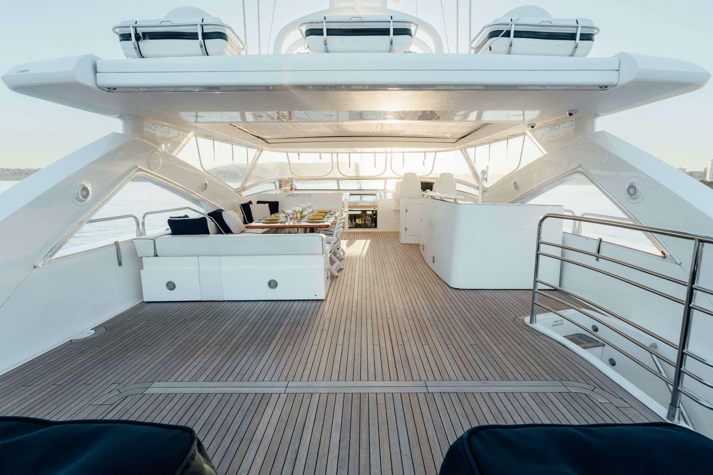 a large white boat aboard CHAOS Yacht for Charter