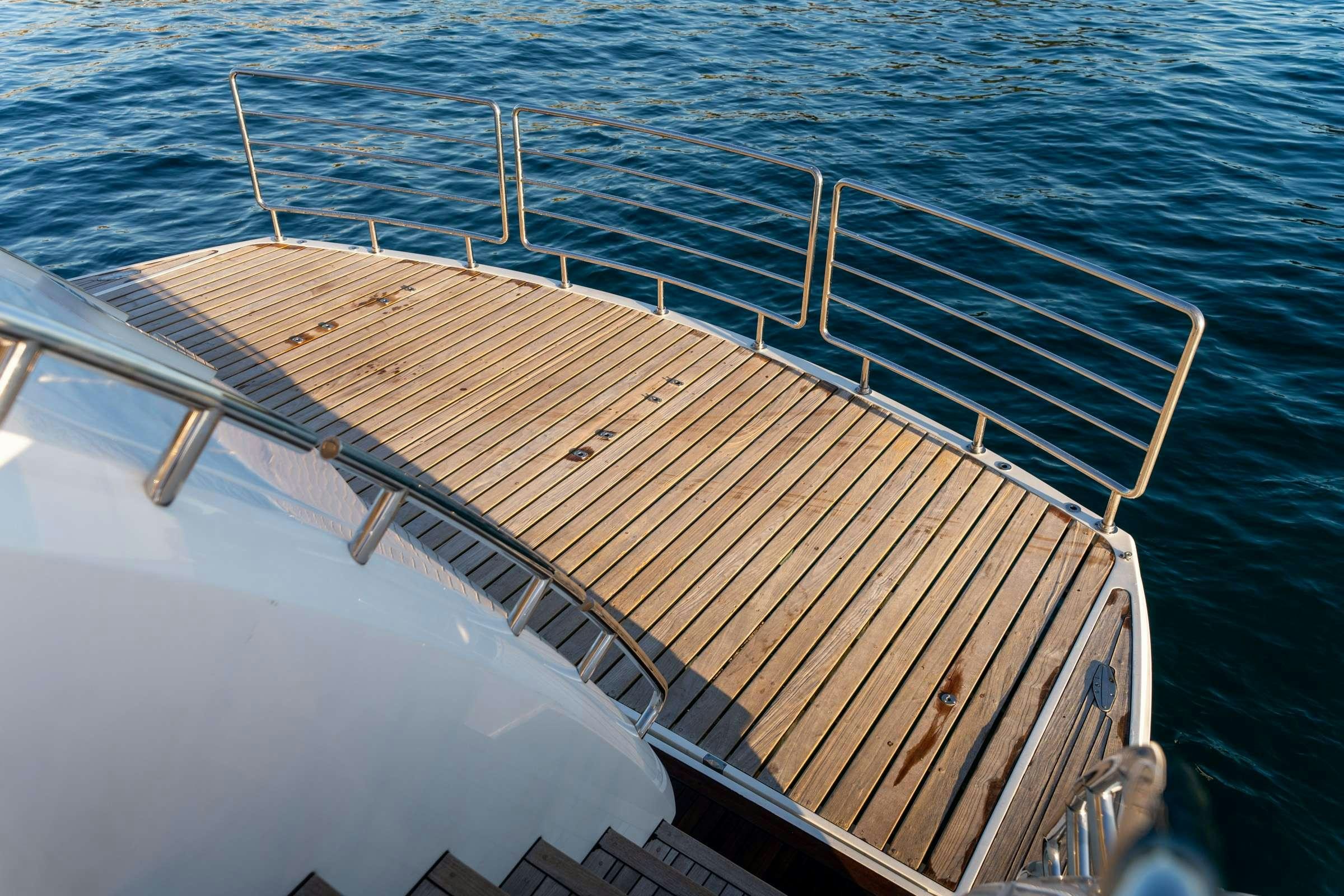 a wooden boat in the water aboard CHAOS Yacht for Charter