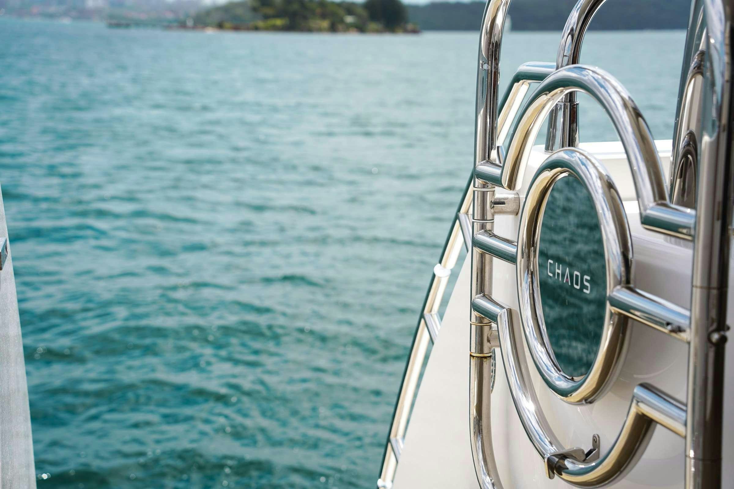 a boat with a sign on the front aboard CHAOS Yacht for Charter