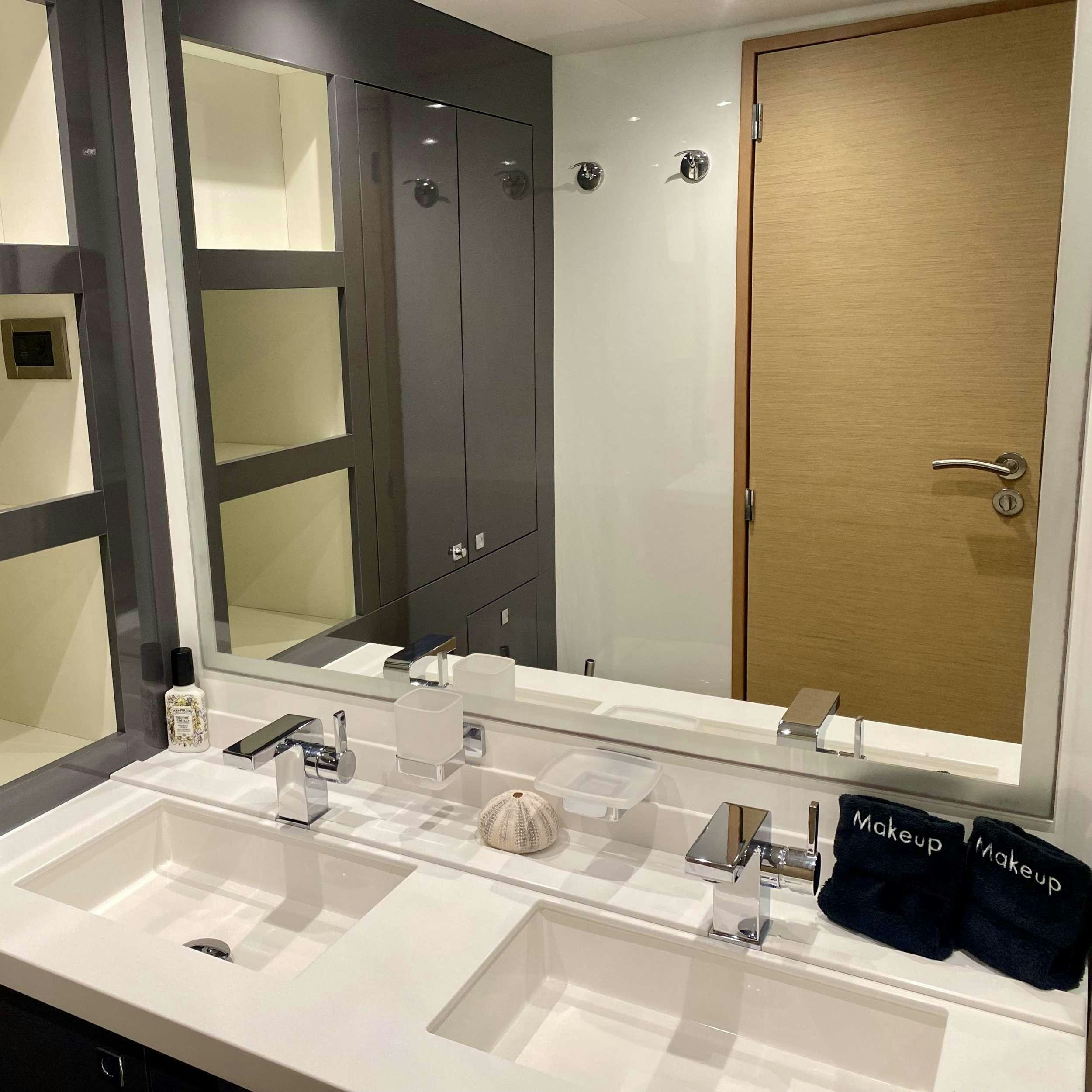 a bathroom with a large mirror aboard SOME KIND OF WONDERFUL Yacht for Charter