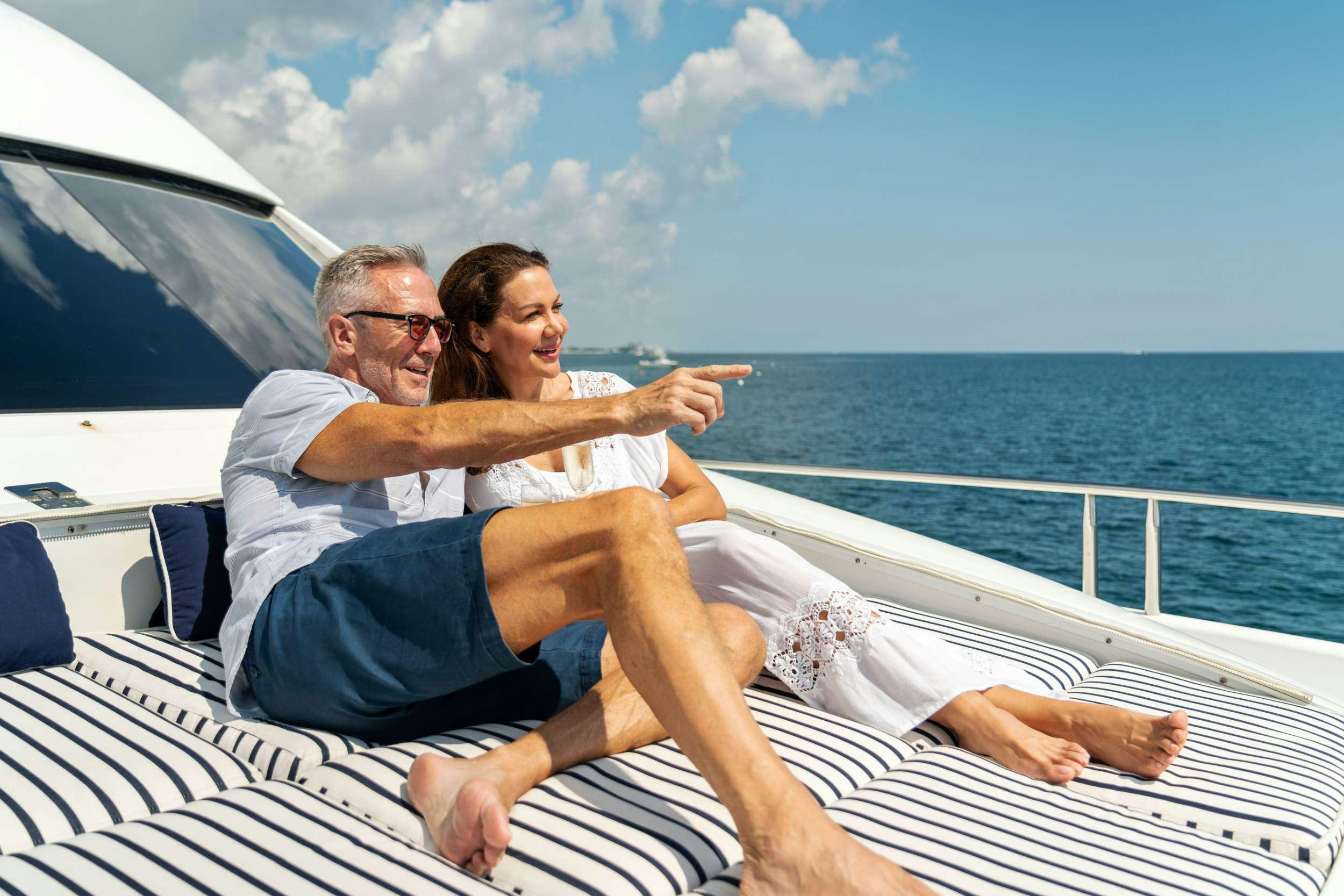 a man and woman on a boat aboard CORAGGIO Yacht for Charter