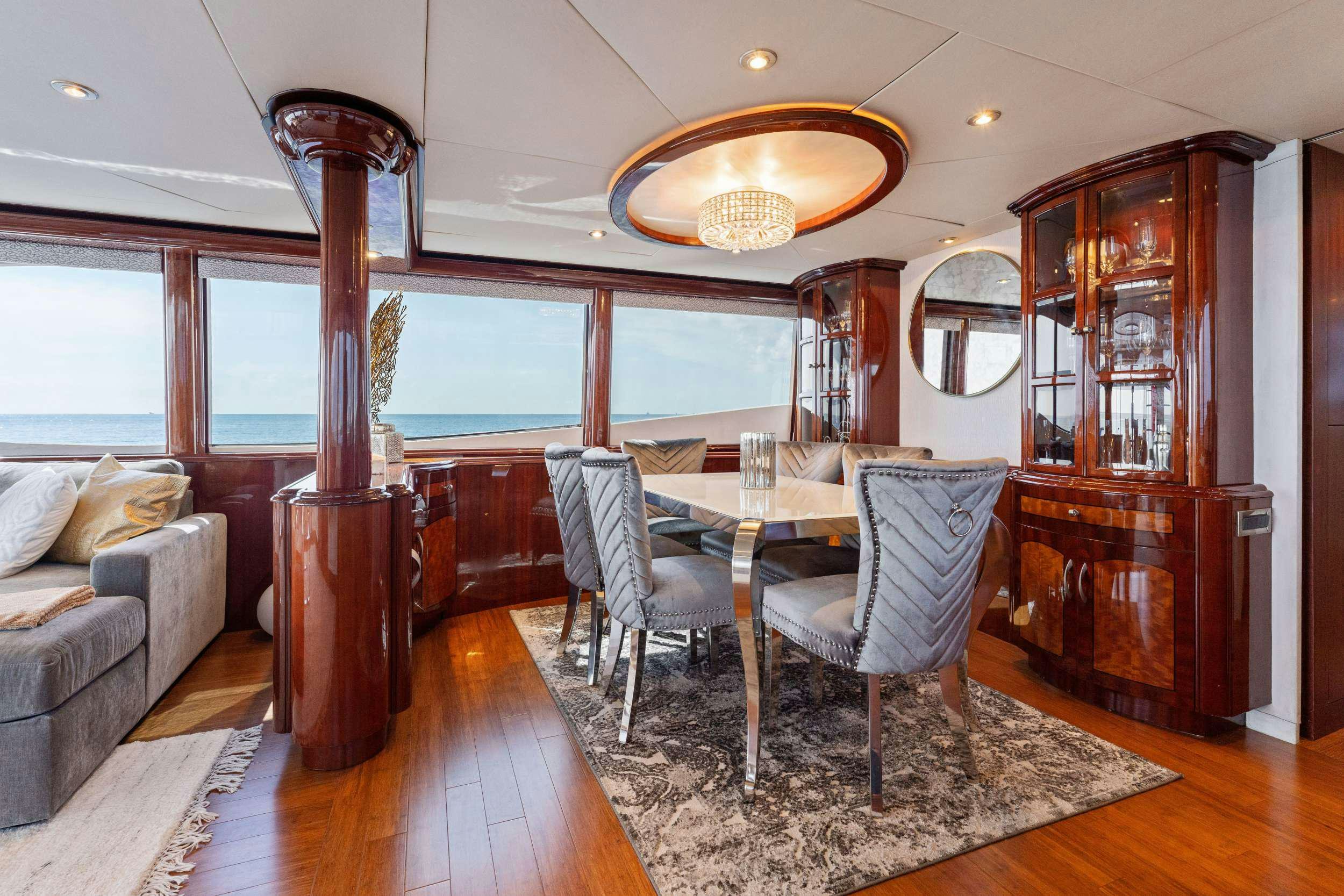 a dining room with a large mirror aboard CORAGGIO Yacht for Charter