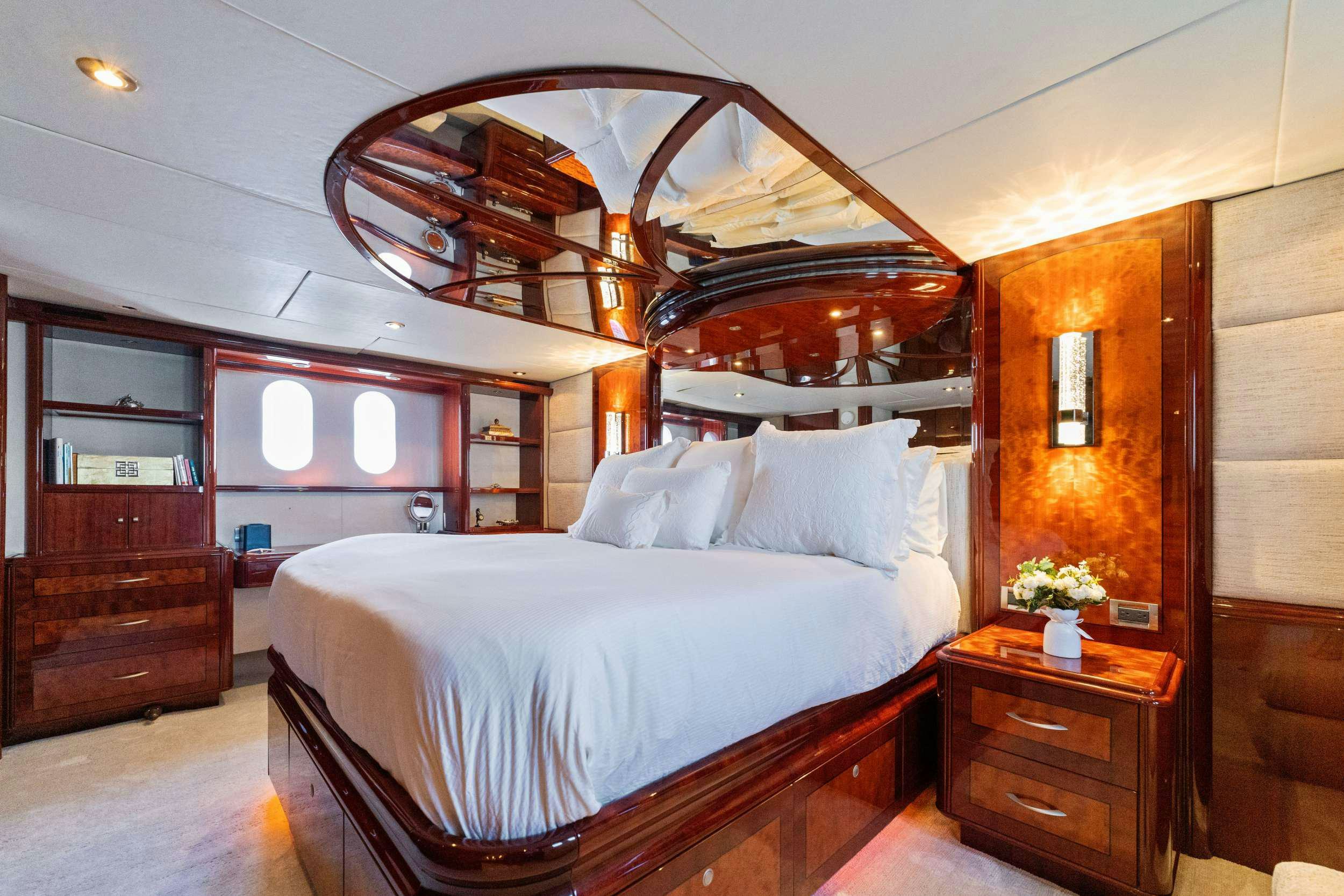 a bed with a white sheet aboard CORAGGIO Yacht for Charter
