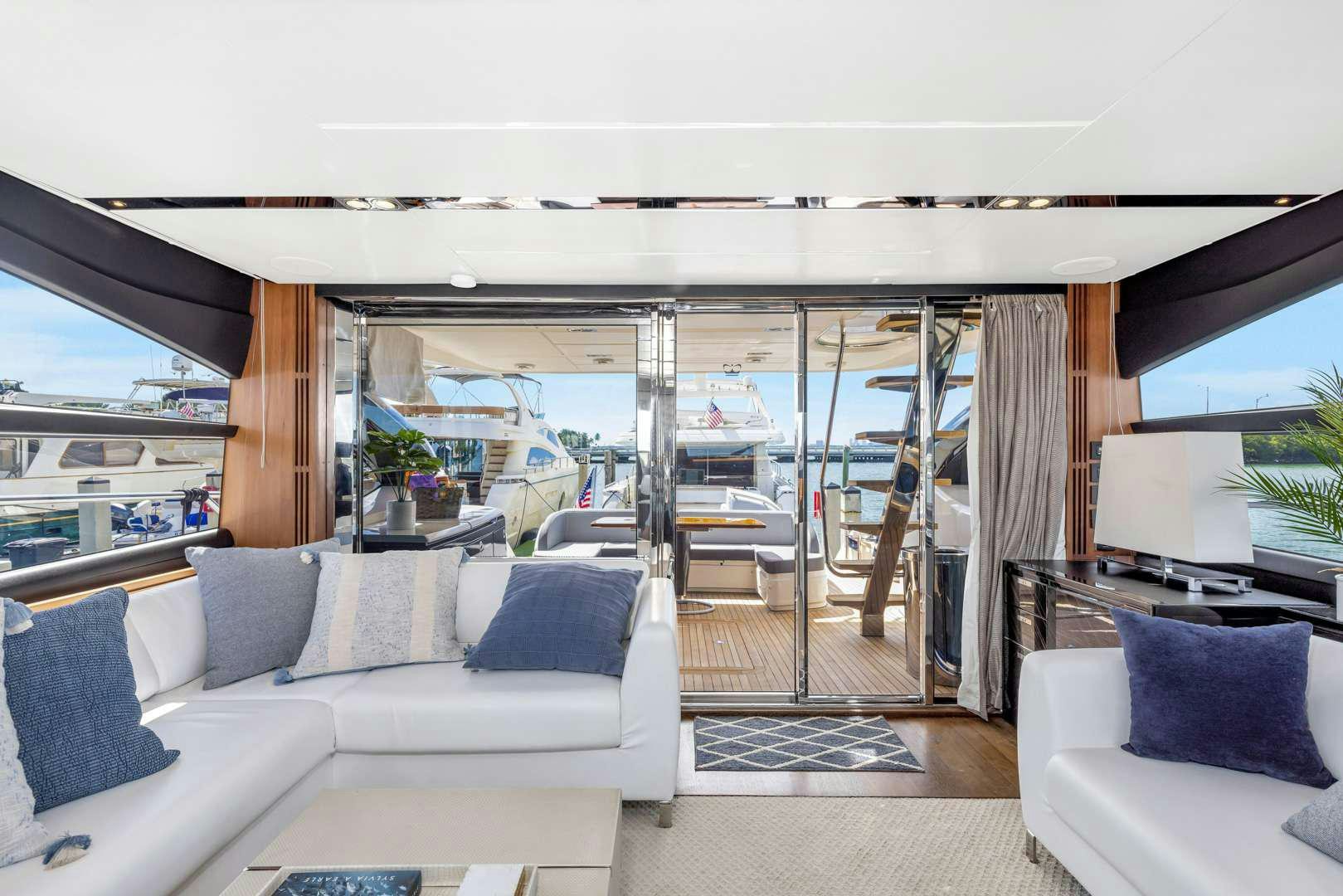 a living room with a sliding glass door aboard SNOWBIRD Yacht for Charter