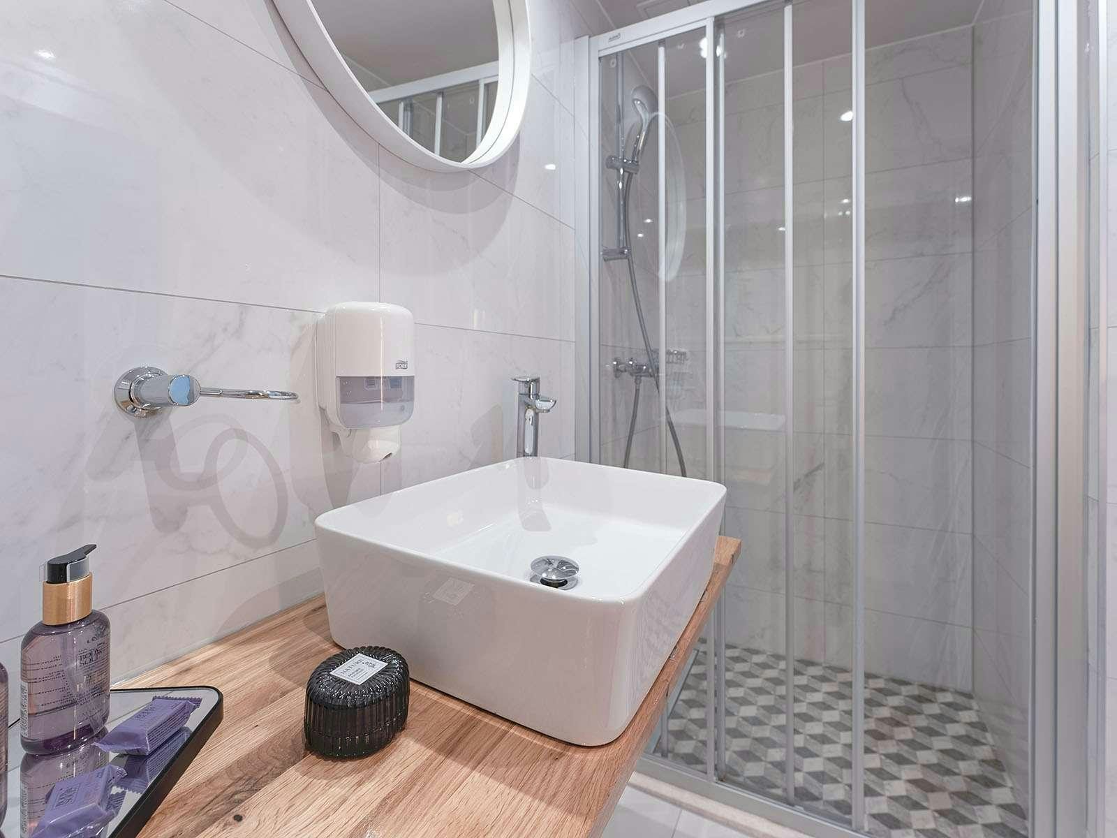 a bathroom with a tub and shower aboard BELLEZZA Yacht for Charter