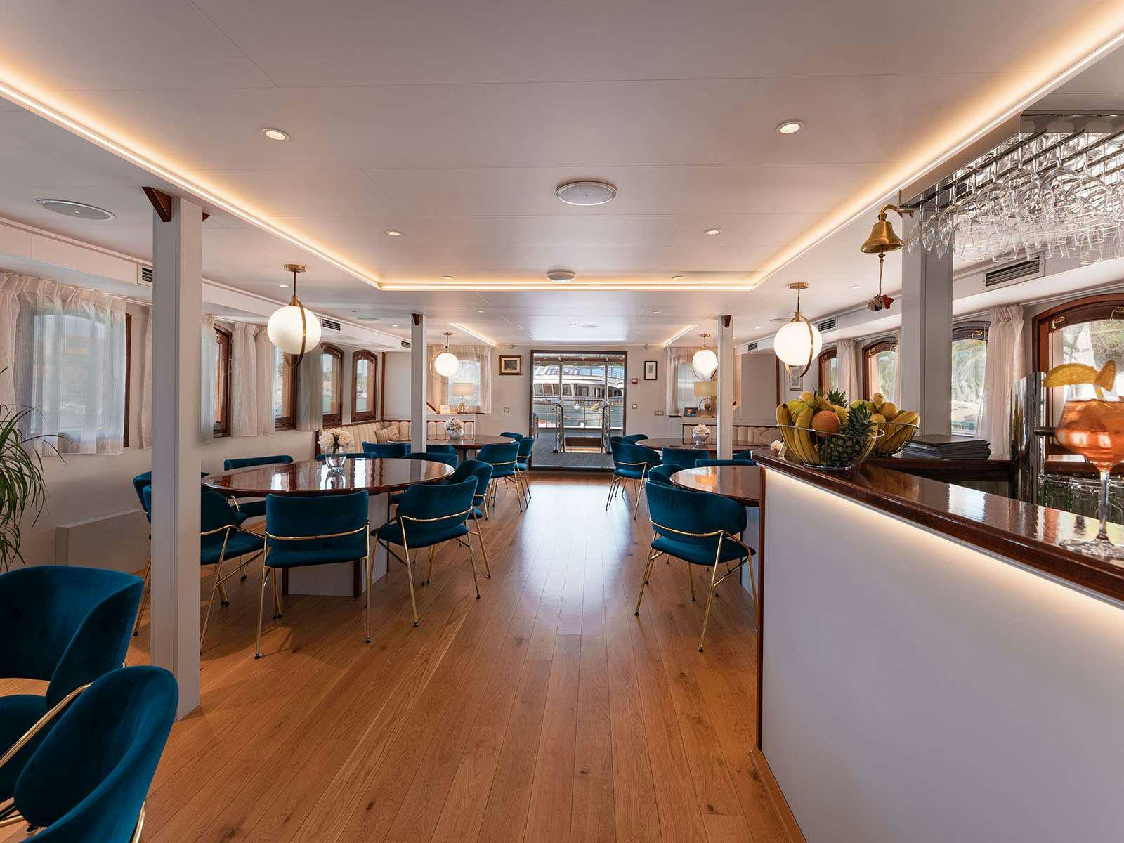 a large kitchen and dining area aboard BELLEZZA Yacht for Charter