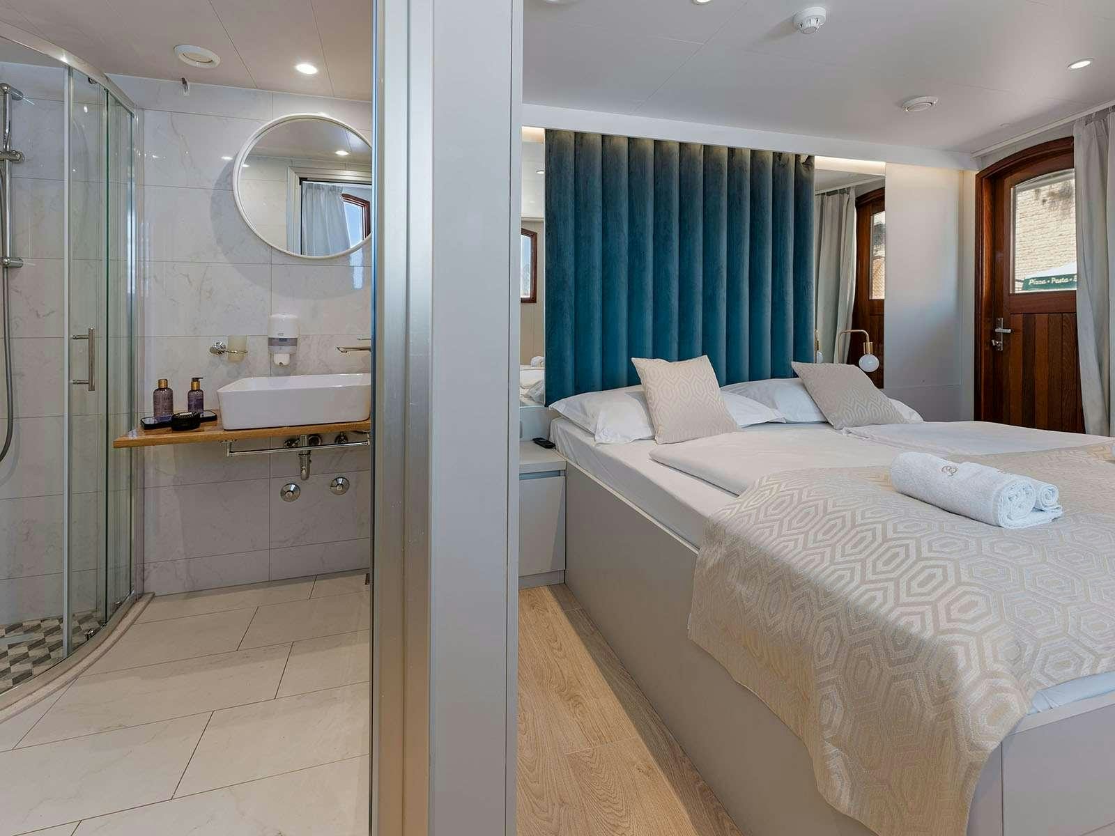 a bedroom with a large mirror aboard BELLEZZA Yacht for Charter
