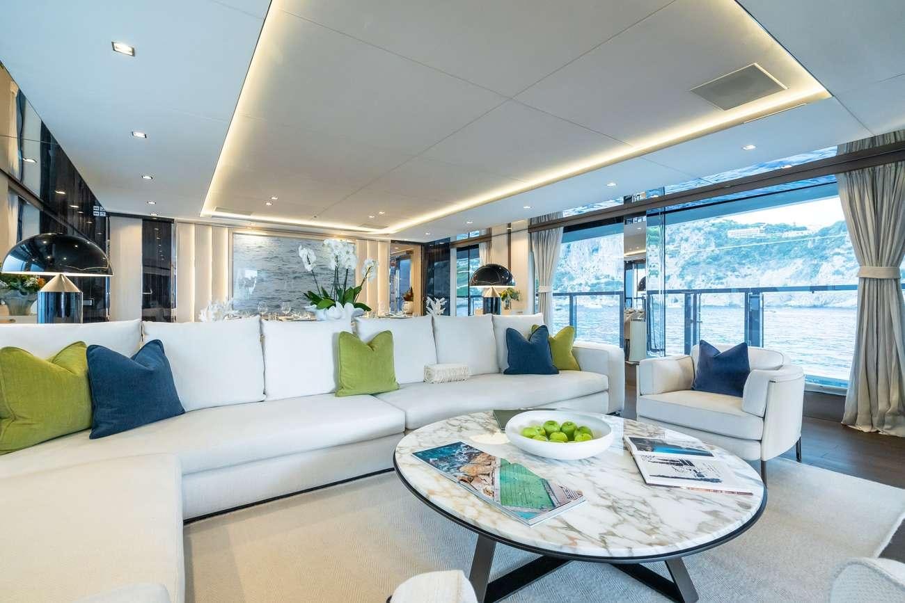 a living room with a large window aboard HALARA Yacht for Charter