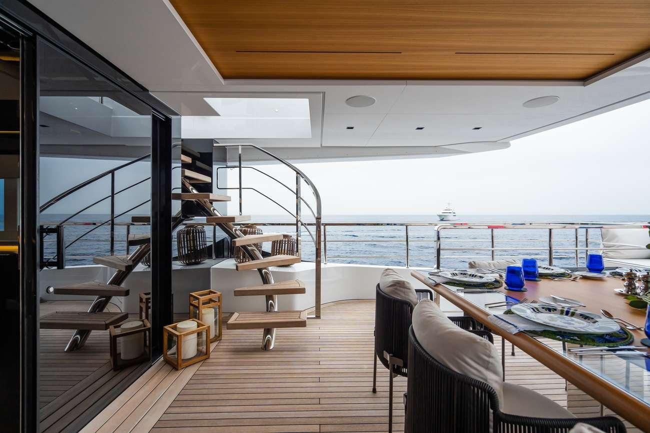 a room with a table and chairs aboard HALARA Yacht for Charter