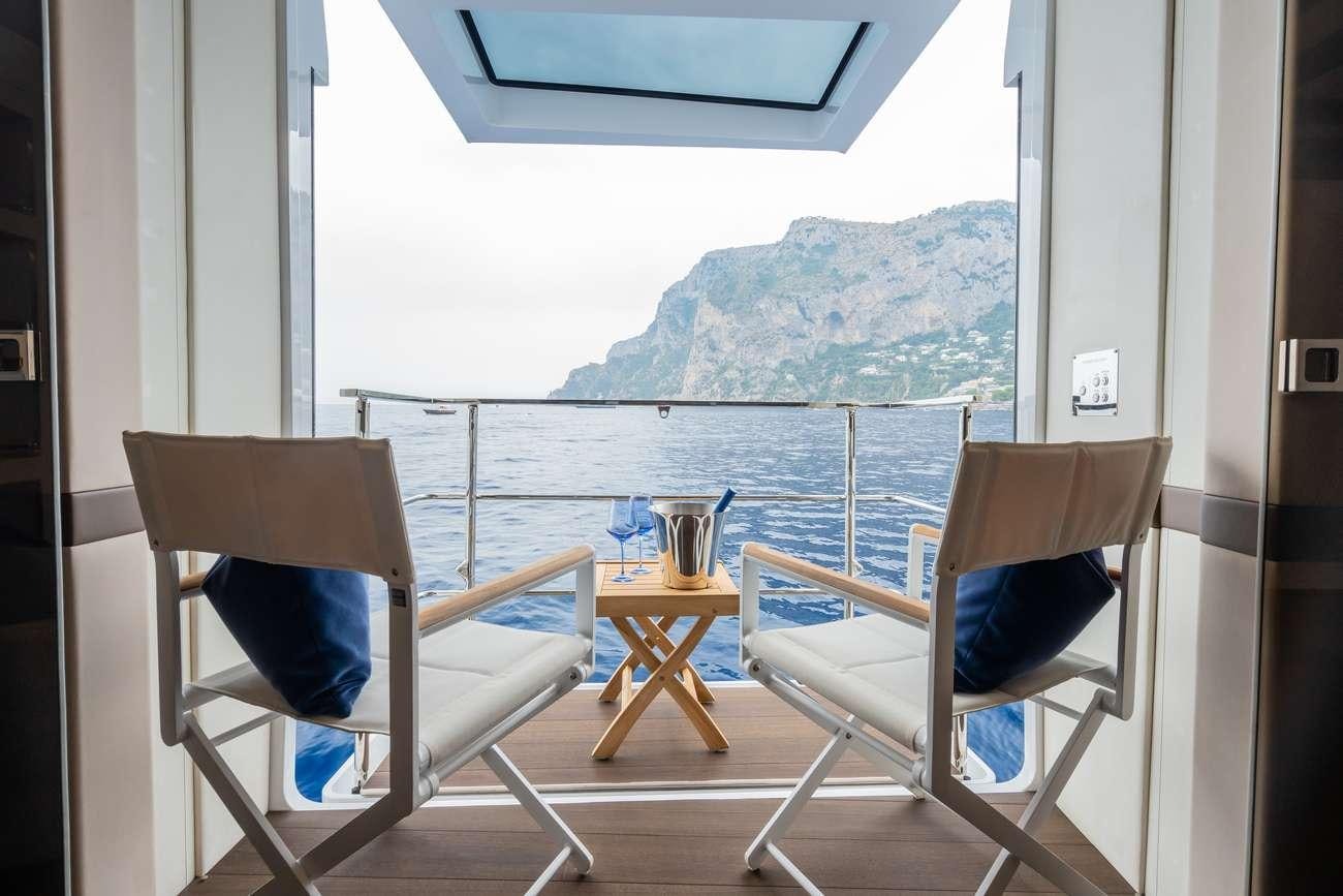chairs on a porch aboard HALARA Yacht for Charter