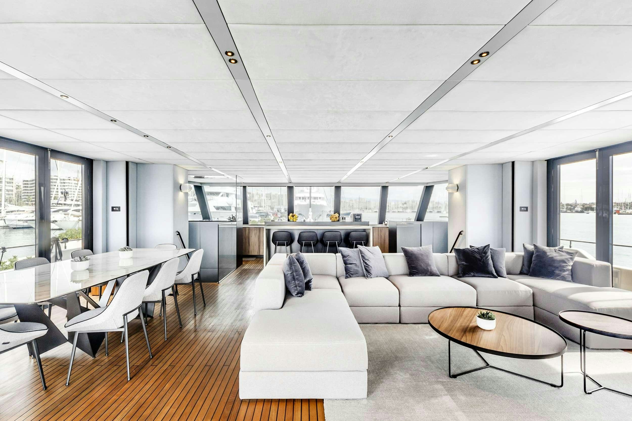 a living room with a couch and a table aboard MIDORI Yacht for Charter