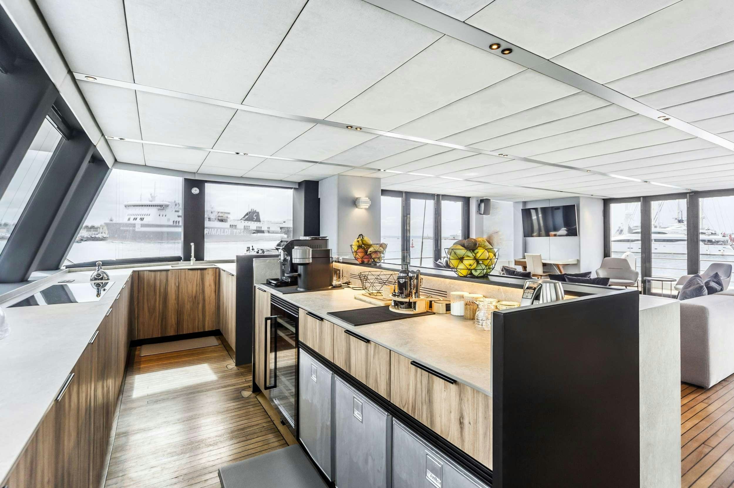 a kitchen with a large island aboard MIDORI Yacht for Charter