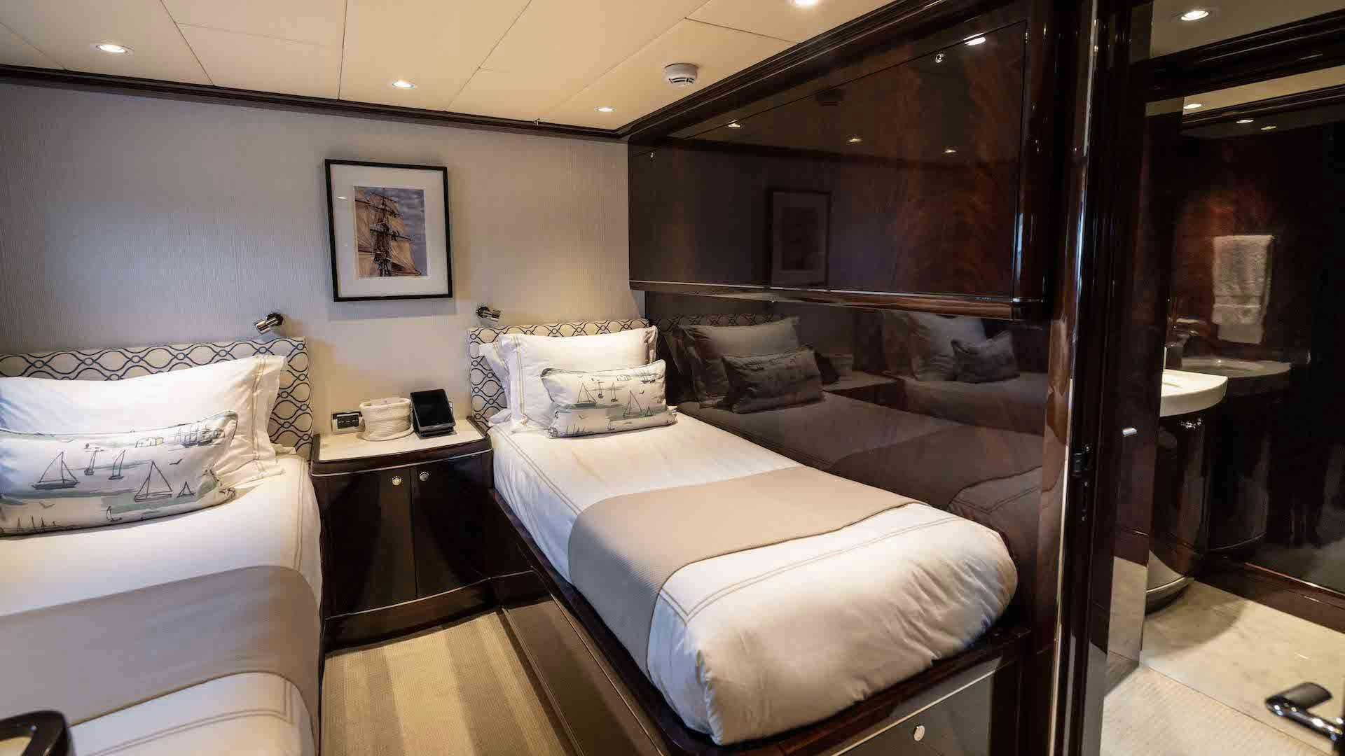 a room with a bed and a desk aboard ANEMOI Yacht for Charter