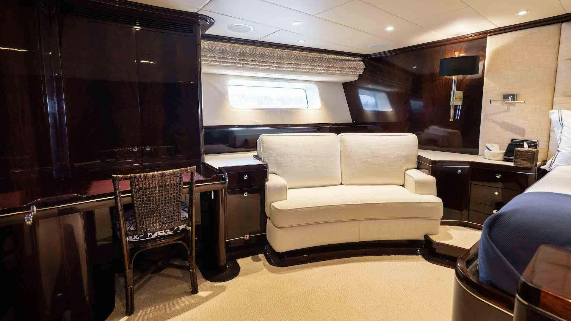 a room with a couch and a tv aboard ANEMOI Yacht for Charter