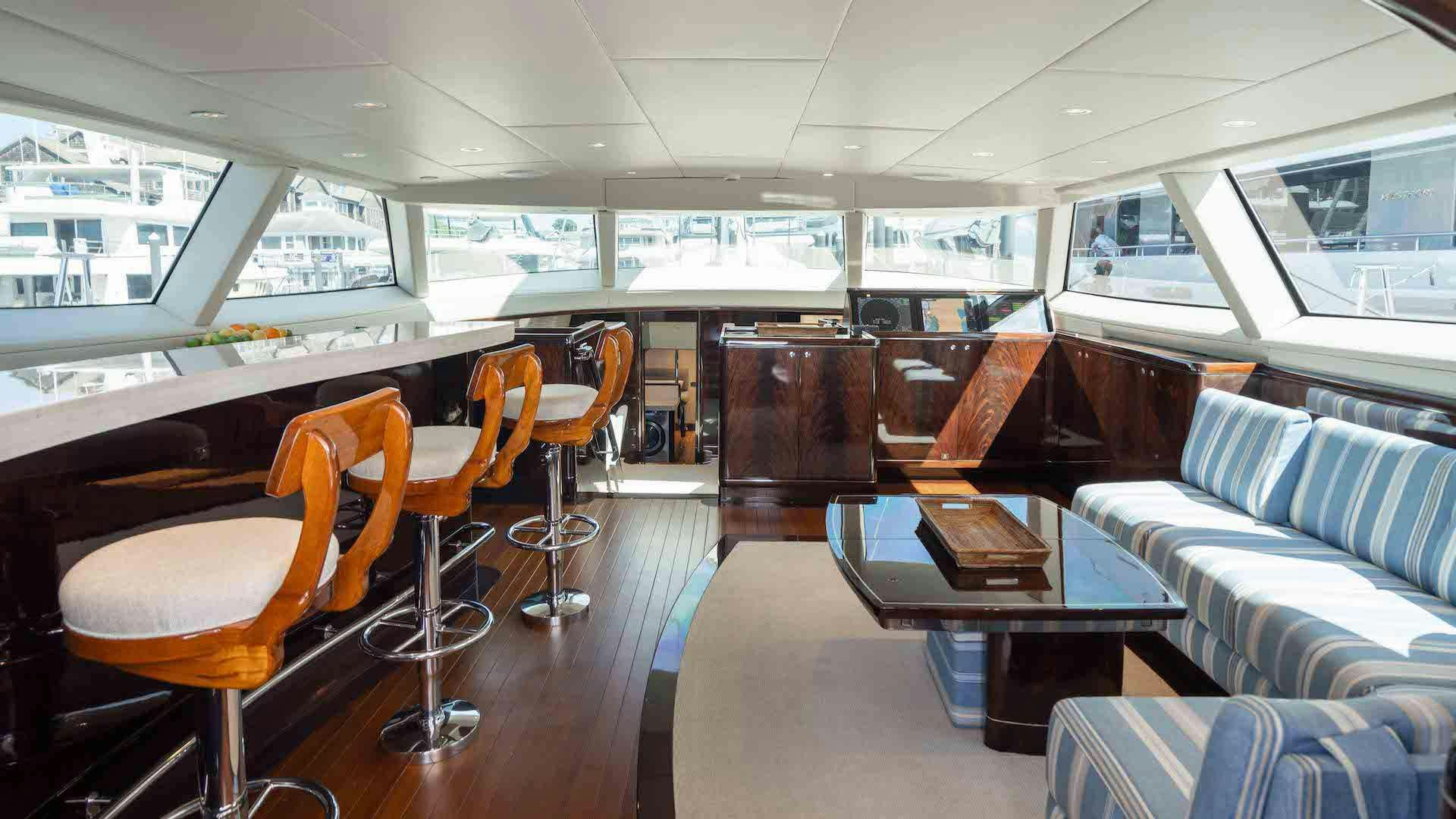 a room with a table and chairs aboard ANEMOI Yacht for Charter