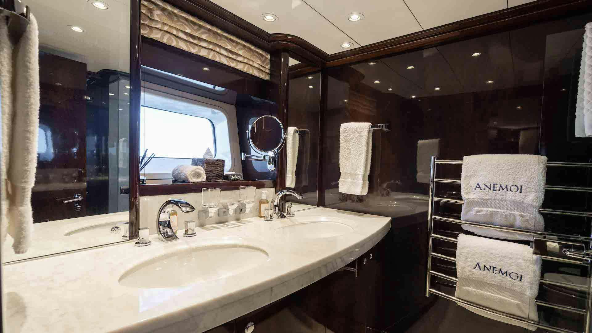 a bathroom with a sink and mirror aboard ANEMOI Yacht for Charter