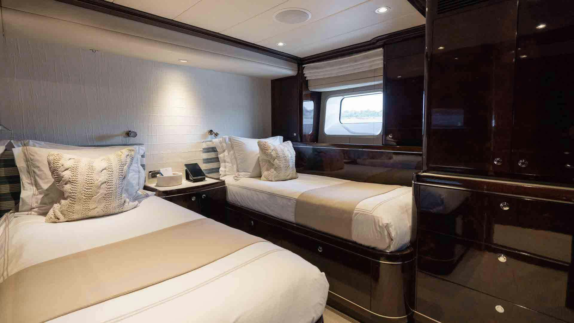 a couple of beds in a room aboard ANEMOI Yacht for Charter