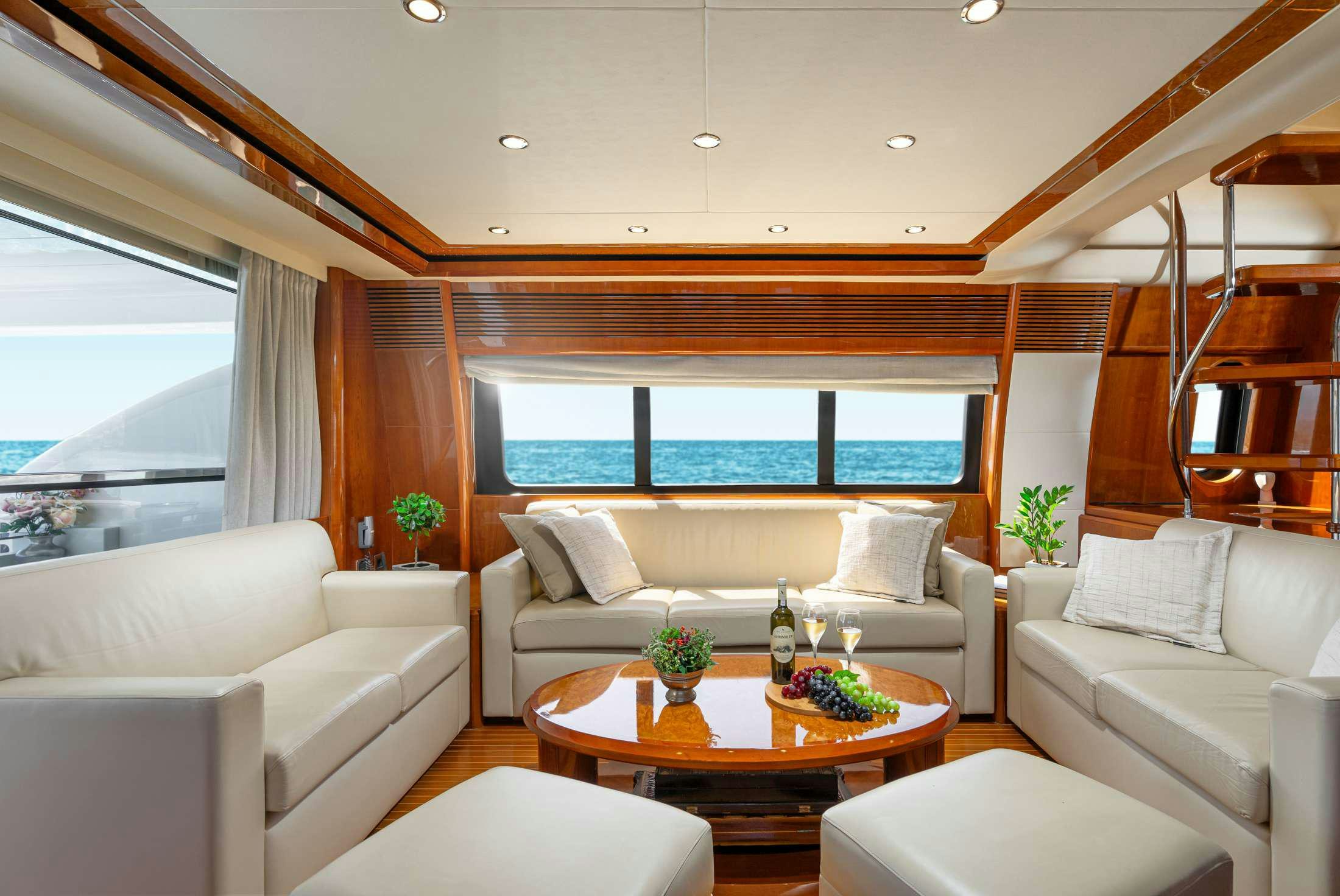 a living room with a large window aboard GEKTOR Yacht for Charter