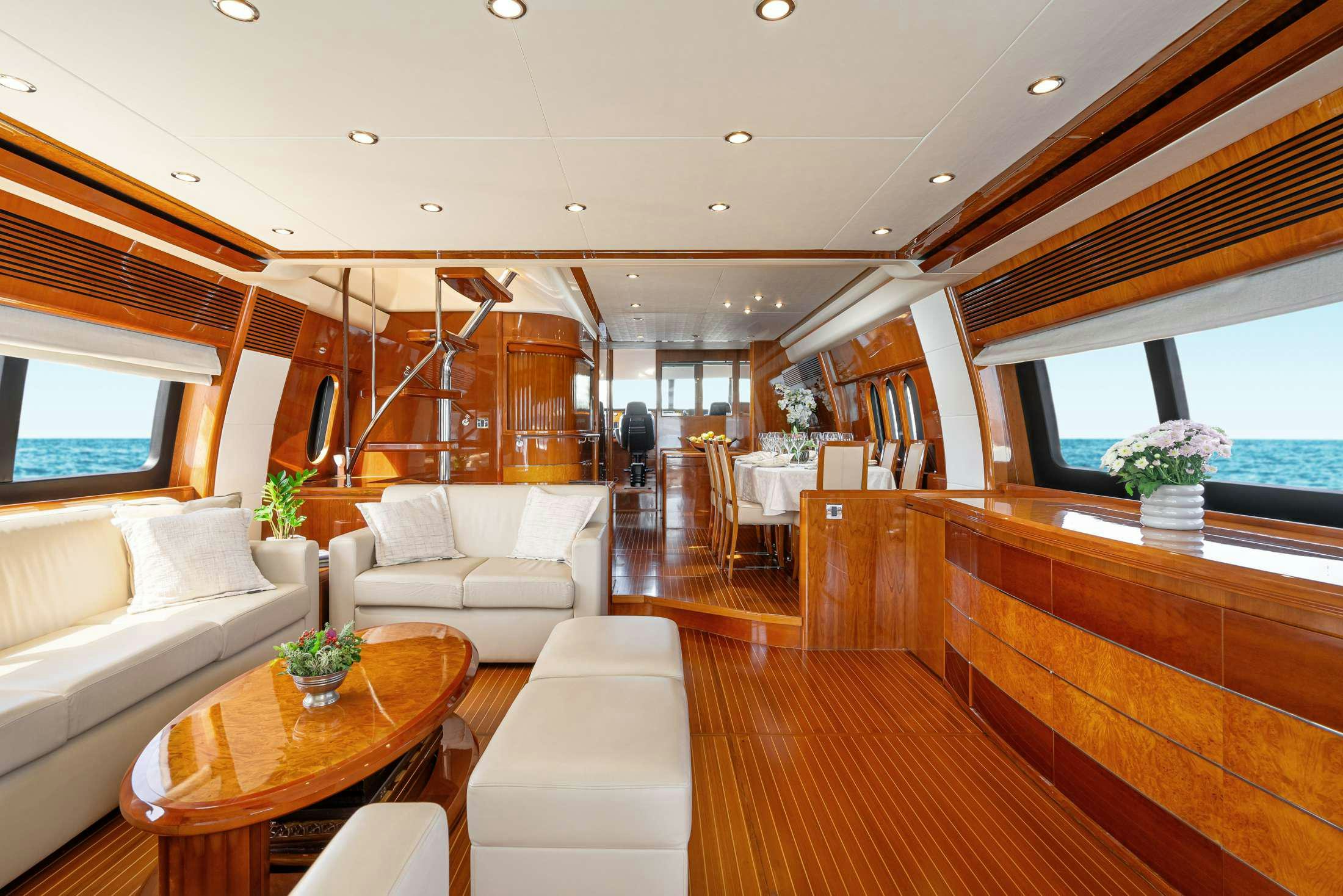 a living room with a large window aboard GEKTOR Yacht for Charter