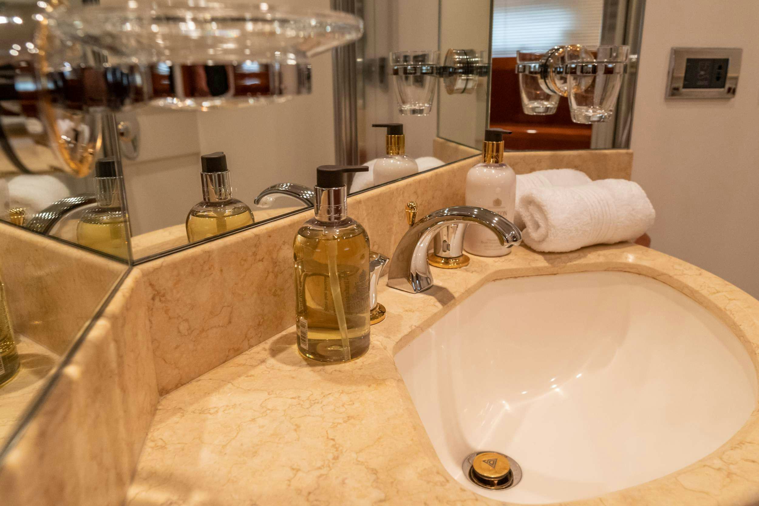 a bathroom with a sink and a mirror aboard GEKTOR Yacht for Charter