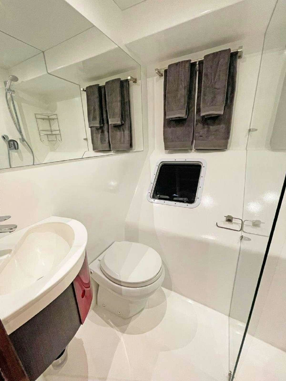 a bathroom with a sink and toilet aboard SKYE Yacht for Charter