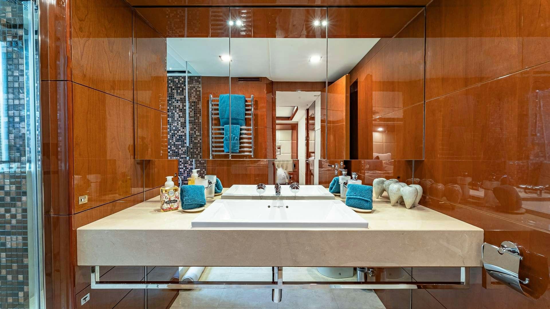 a bathroom with a large sink aboard BEACHFRONT II Yacht for Charter