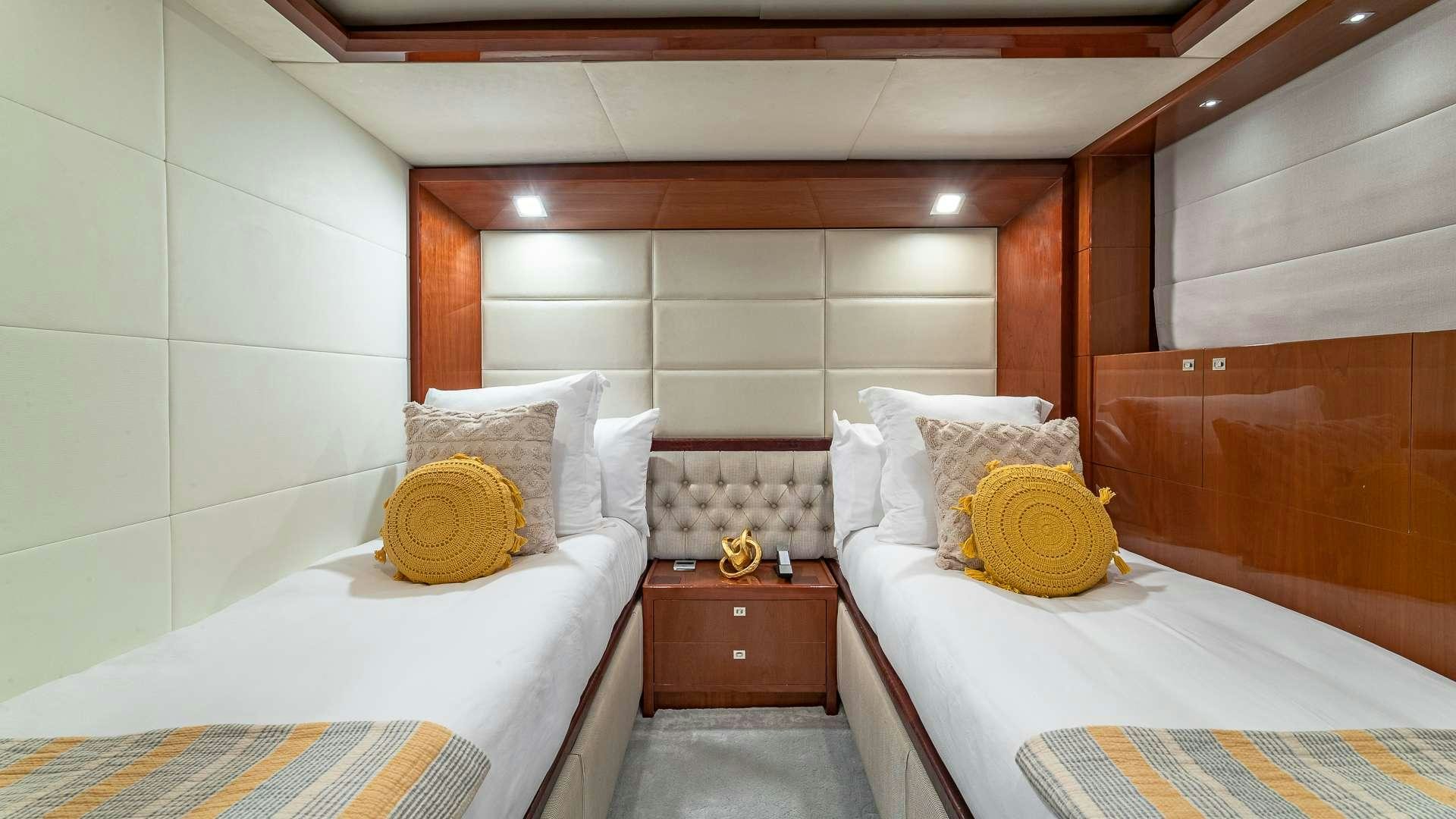 a room with two beds aboard BEACHFRONT II Yacht for Charter