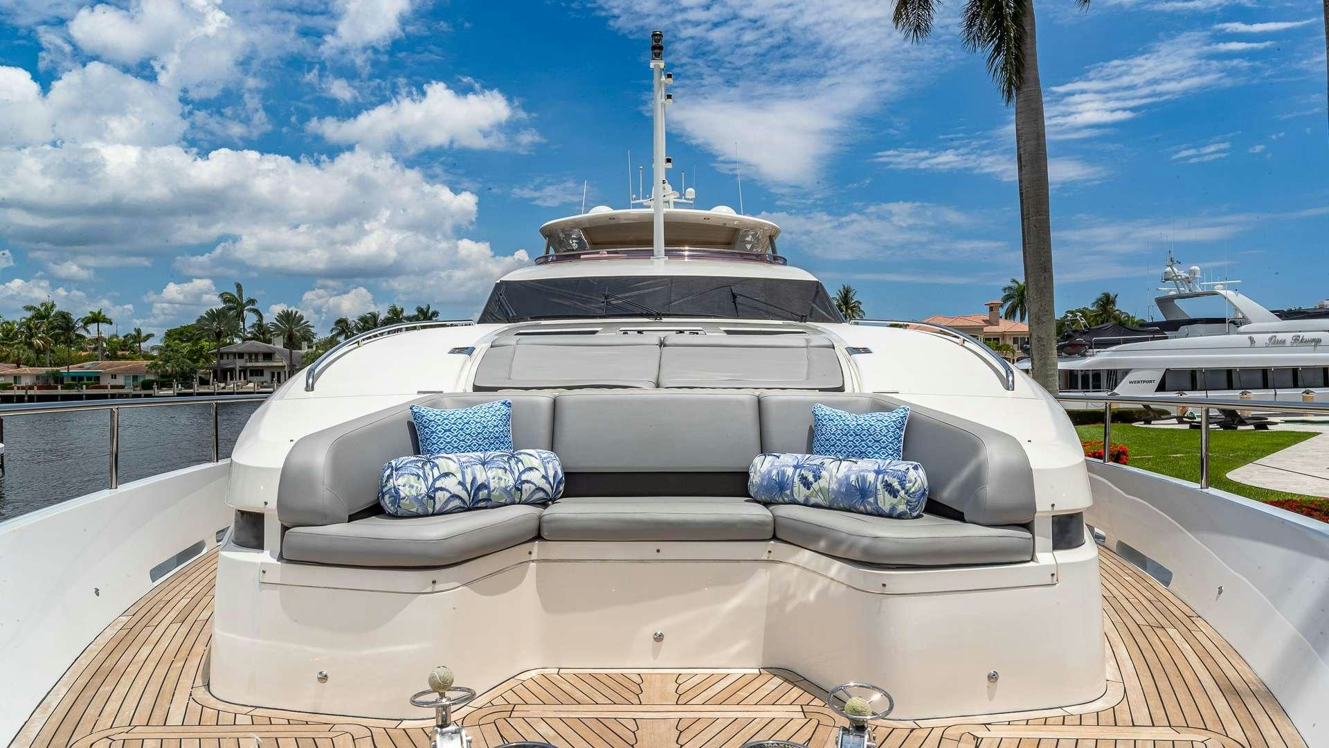 a white car with blue pillows aboard BEACHFRONT II Yacht for Charter
