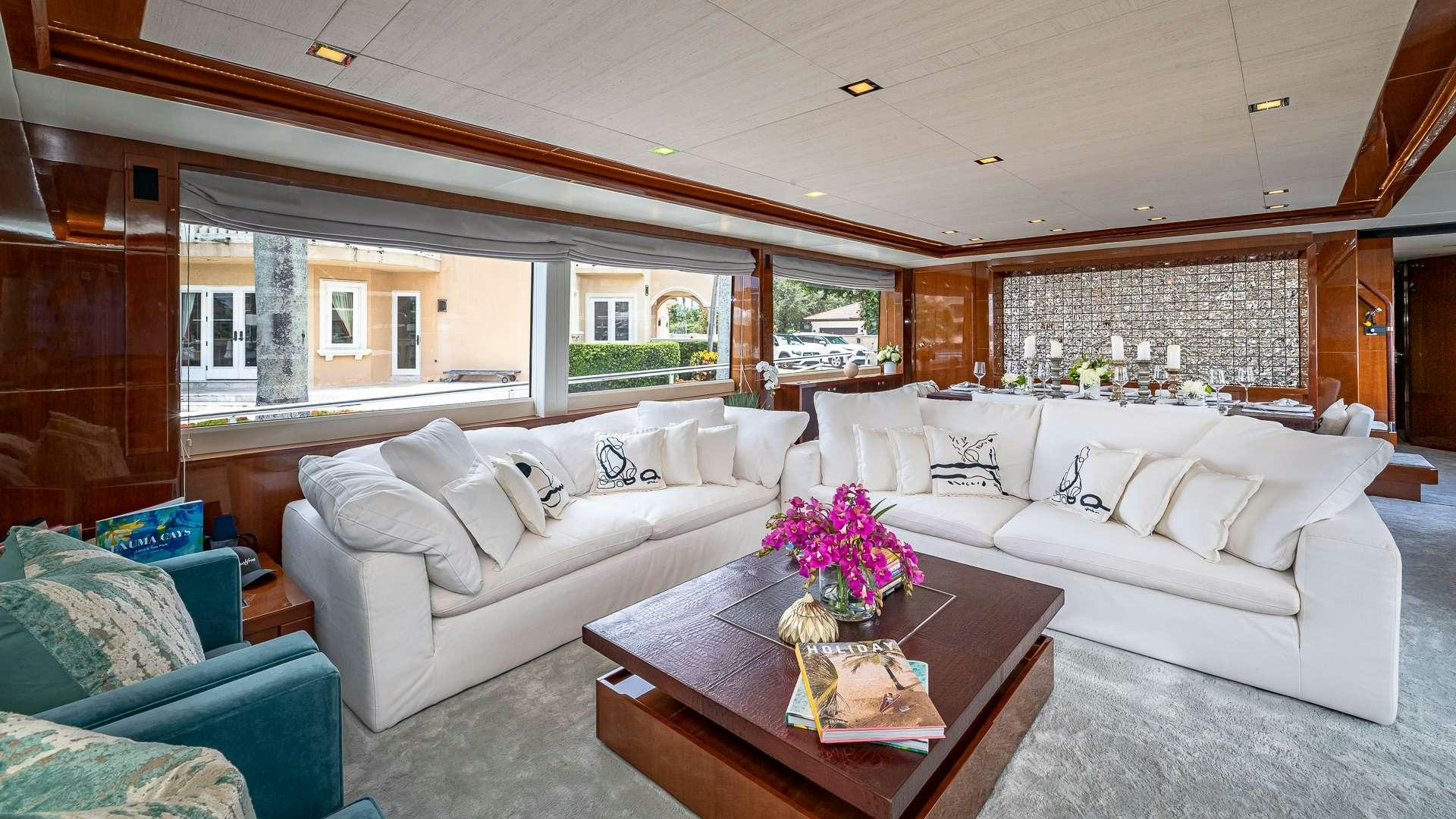 a living room with a couch and a coffee table aboard BEACHFRONT II Yacht for Charter