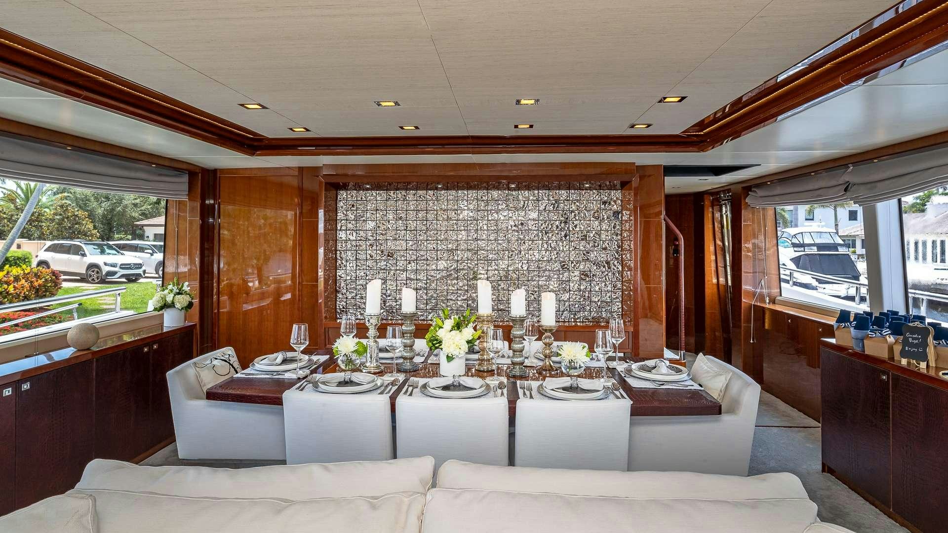 a living room with a couch and a table aboard BEACHFRONT II Yacht for Charter
