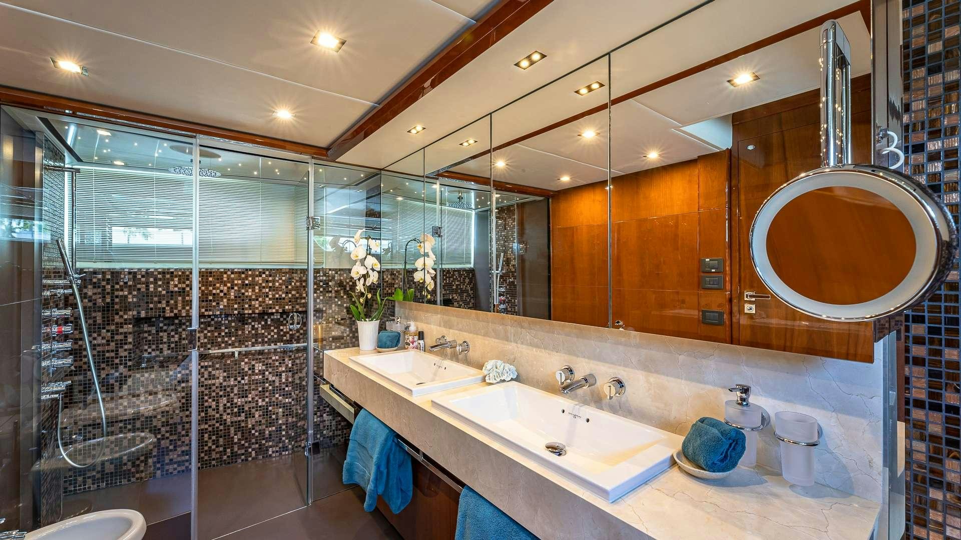 a bathroom with a large mirror aboard BEACHFRONT II Yacht for Charter