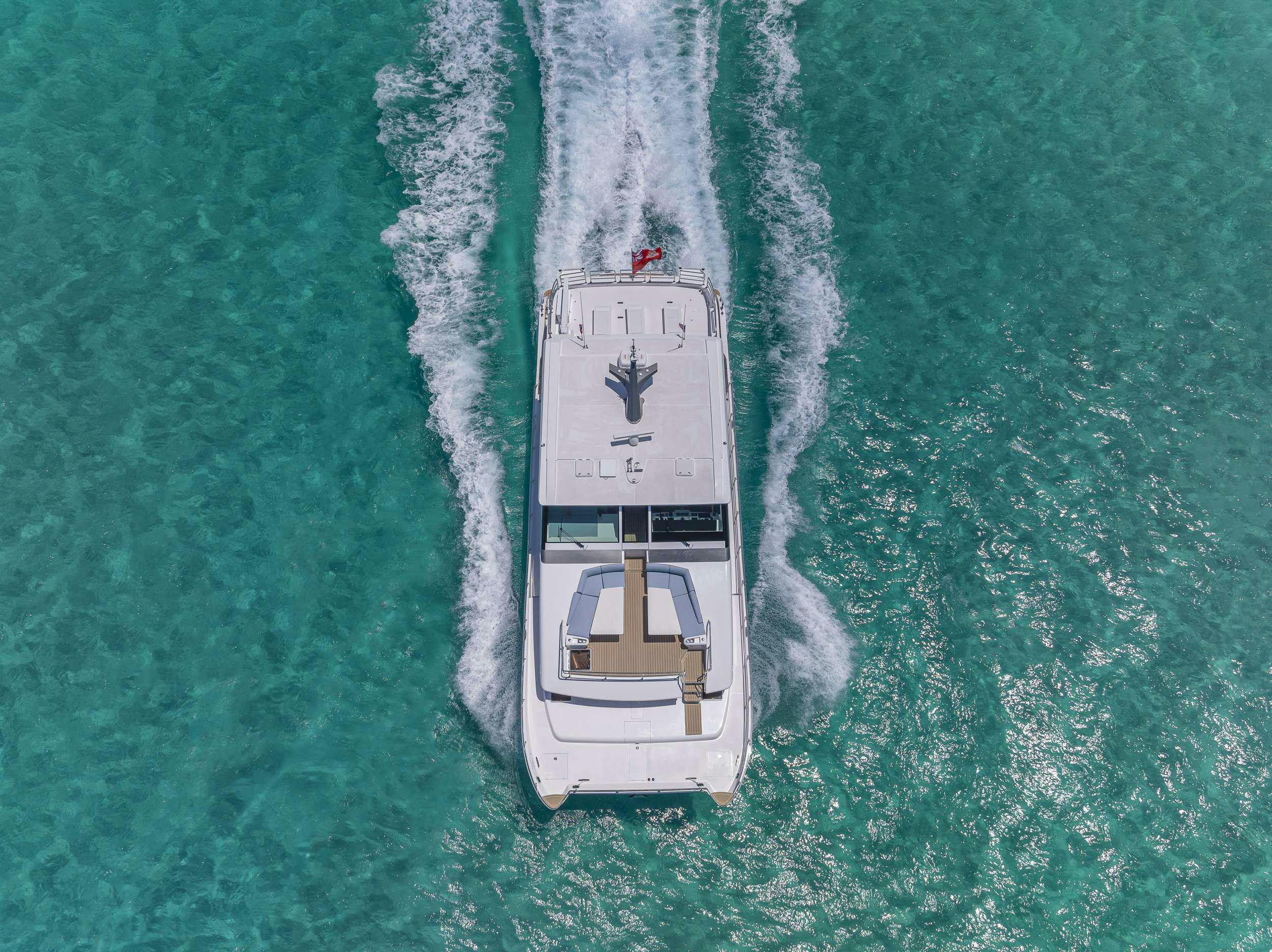 a white and black boat in the water aboard OMAKASE Yacht for Charter