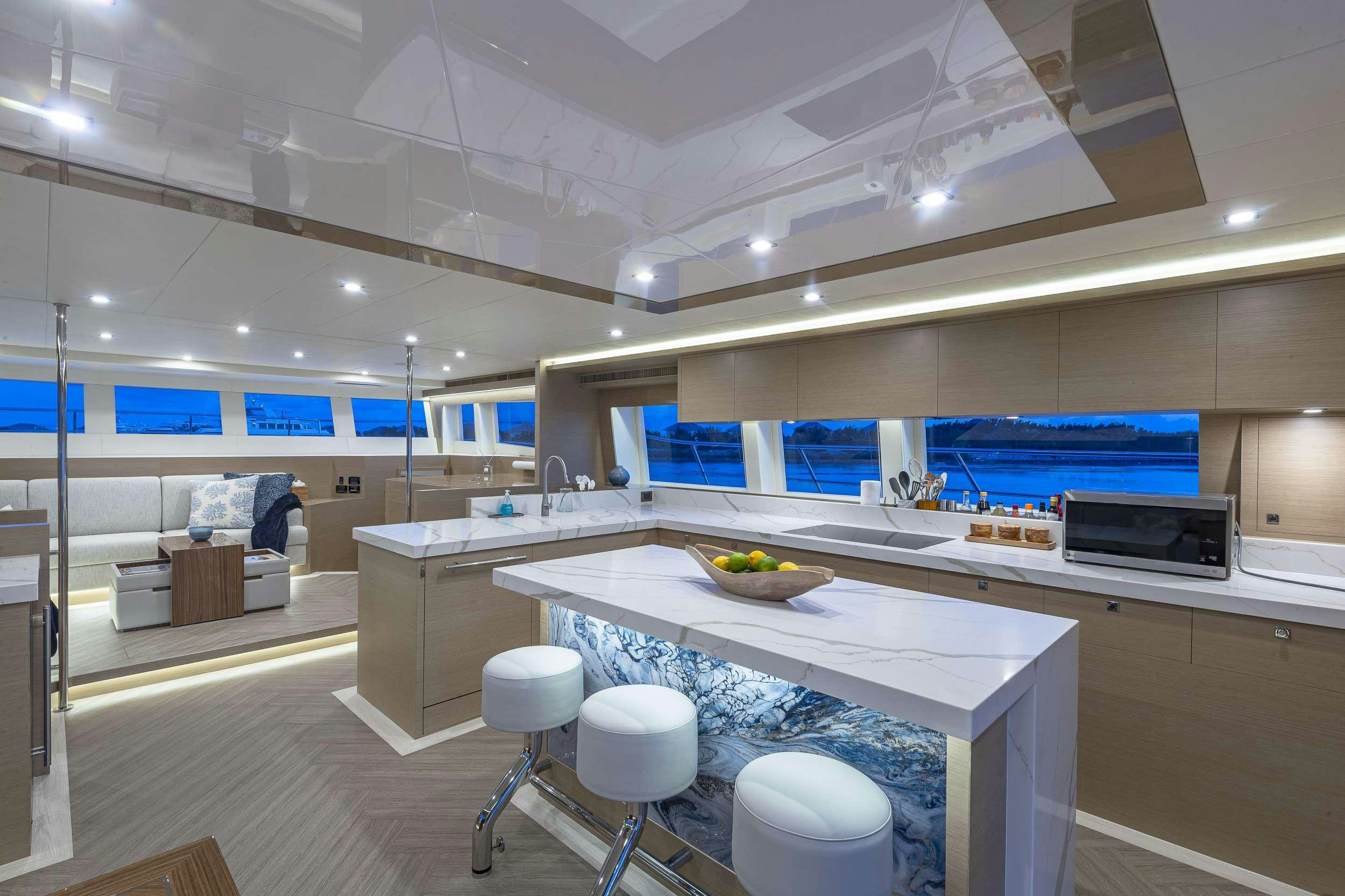 a kitchen with a countertop aboard OMAKASE Yacht for Charter
