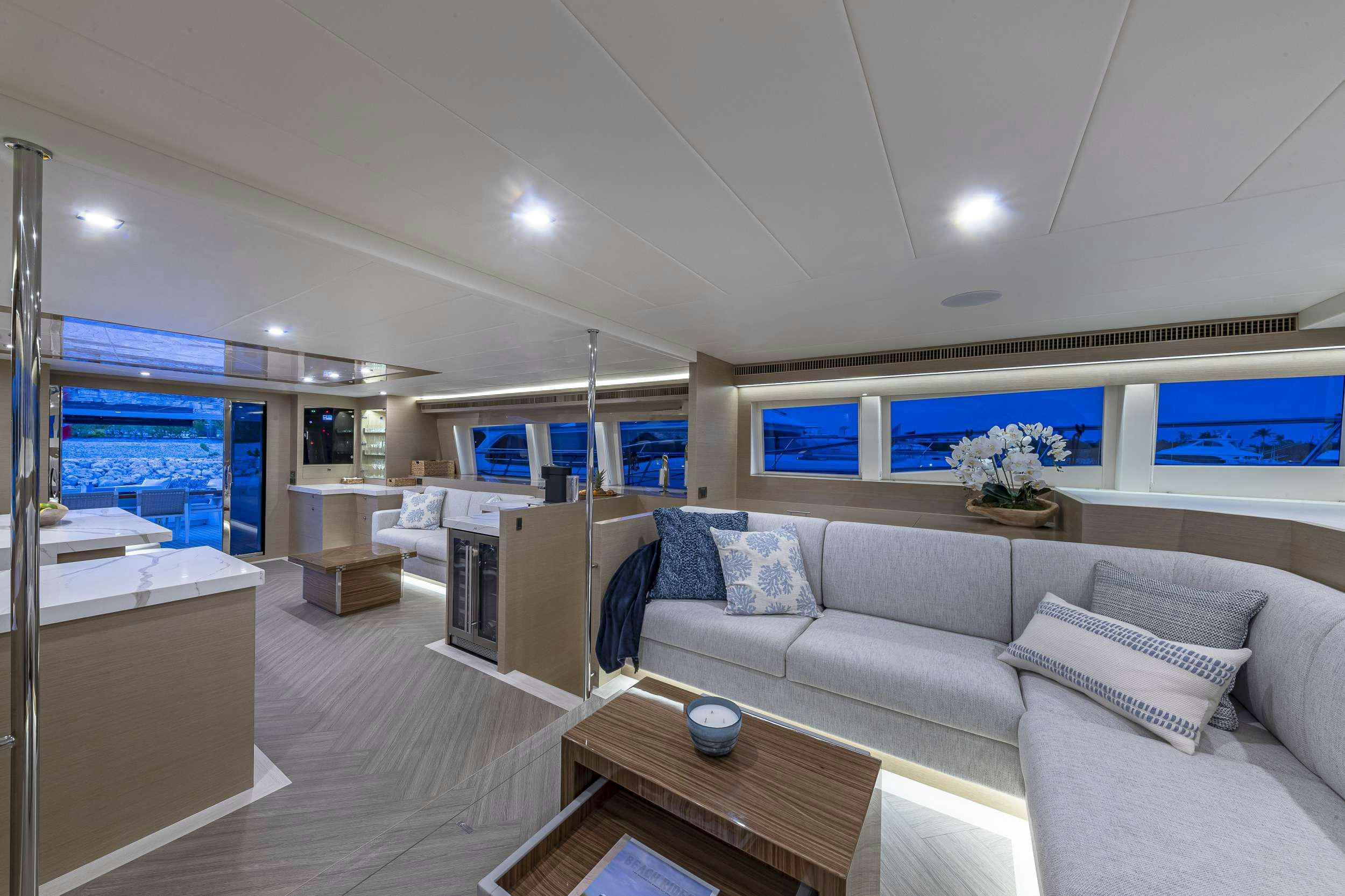 a living room with a couch and a table aboard OMAKASE Yacht for Charter